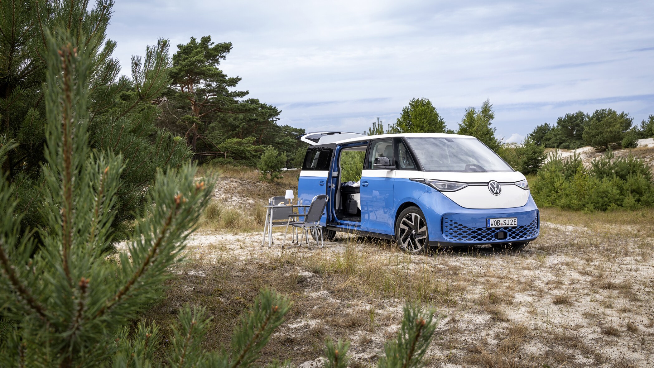 Volkswagen ID. California Cruise electric camper van parked at a campsite