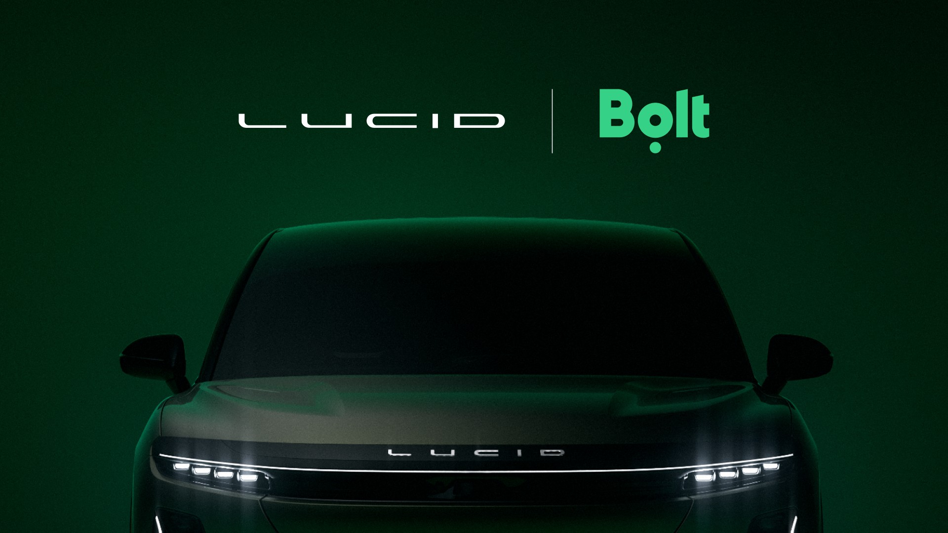 Lucid and Bolt logos above a shadowed Lucid Midsize crossover front end