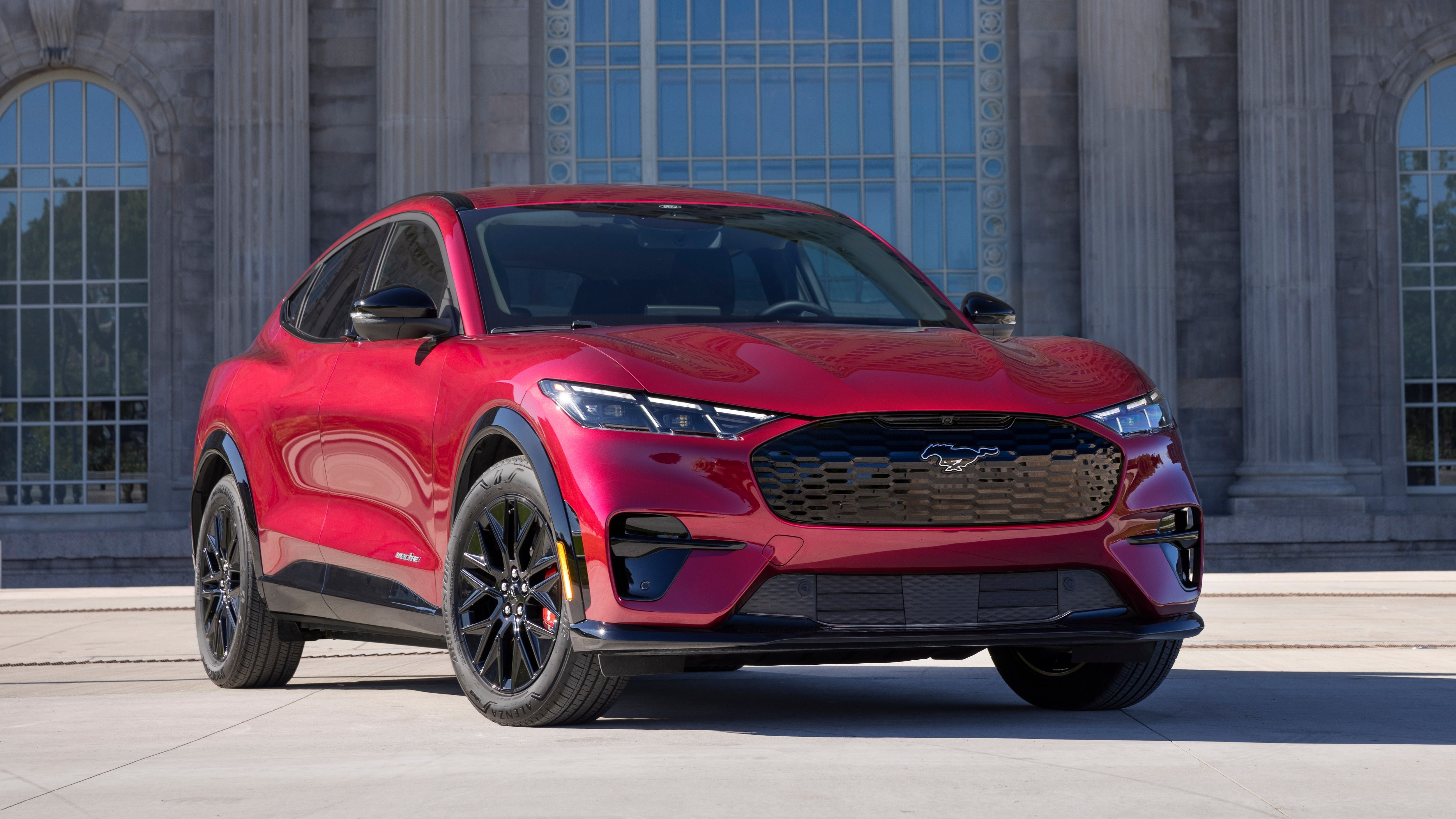 Red Ford Mustang Mach-E electric crossover front three-quarter view