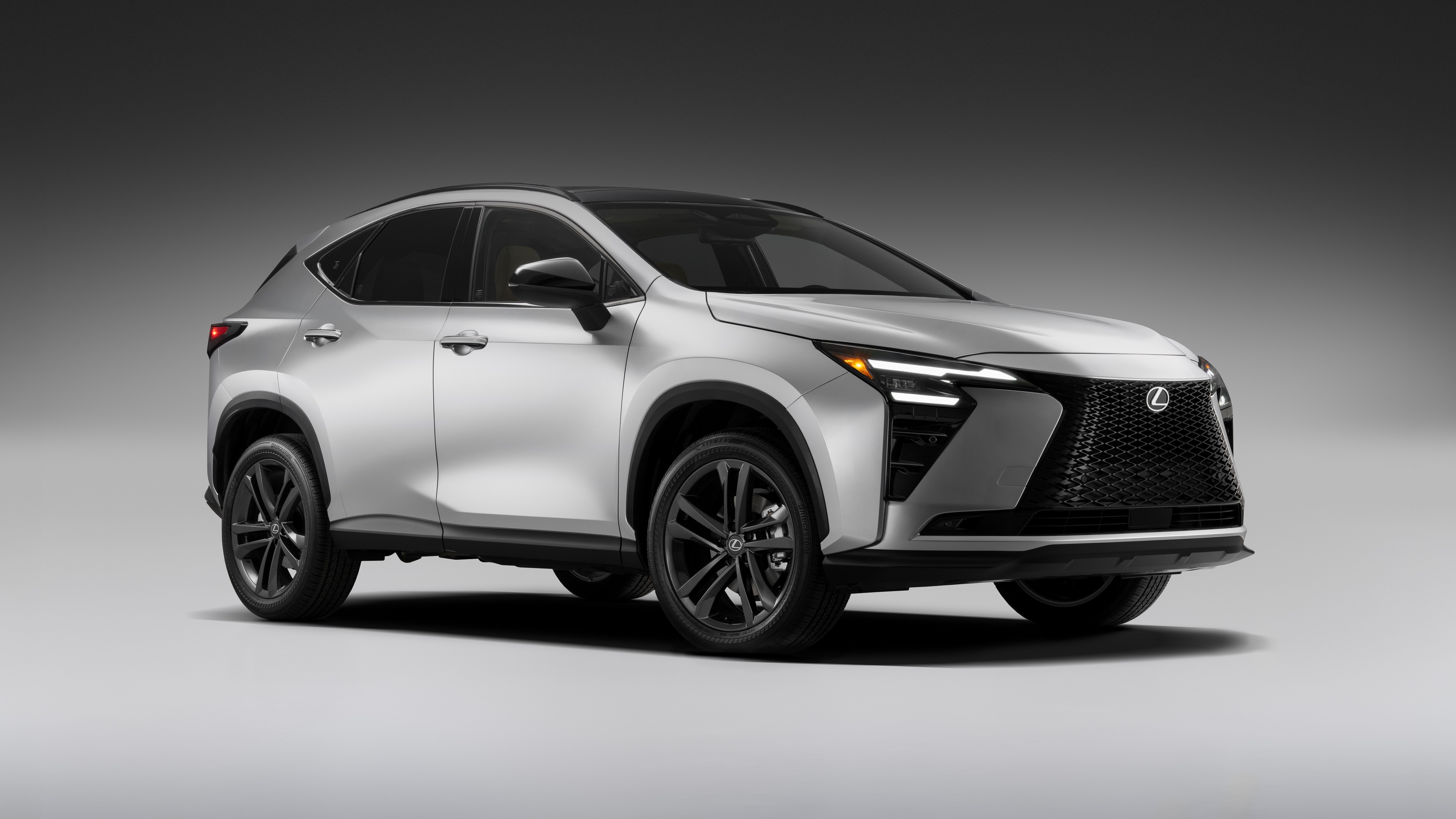 2027 Lexus NX 350h AWD front three-quarter view in silver