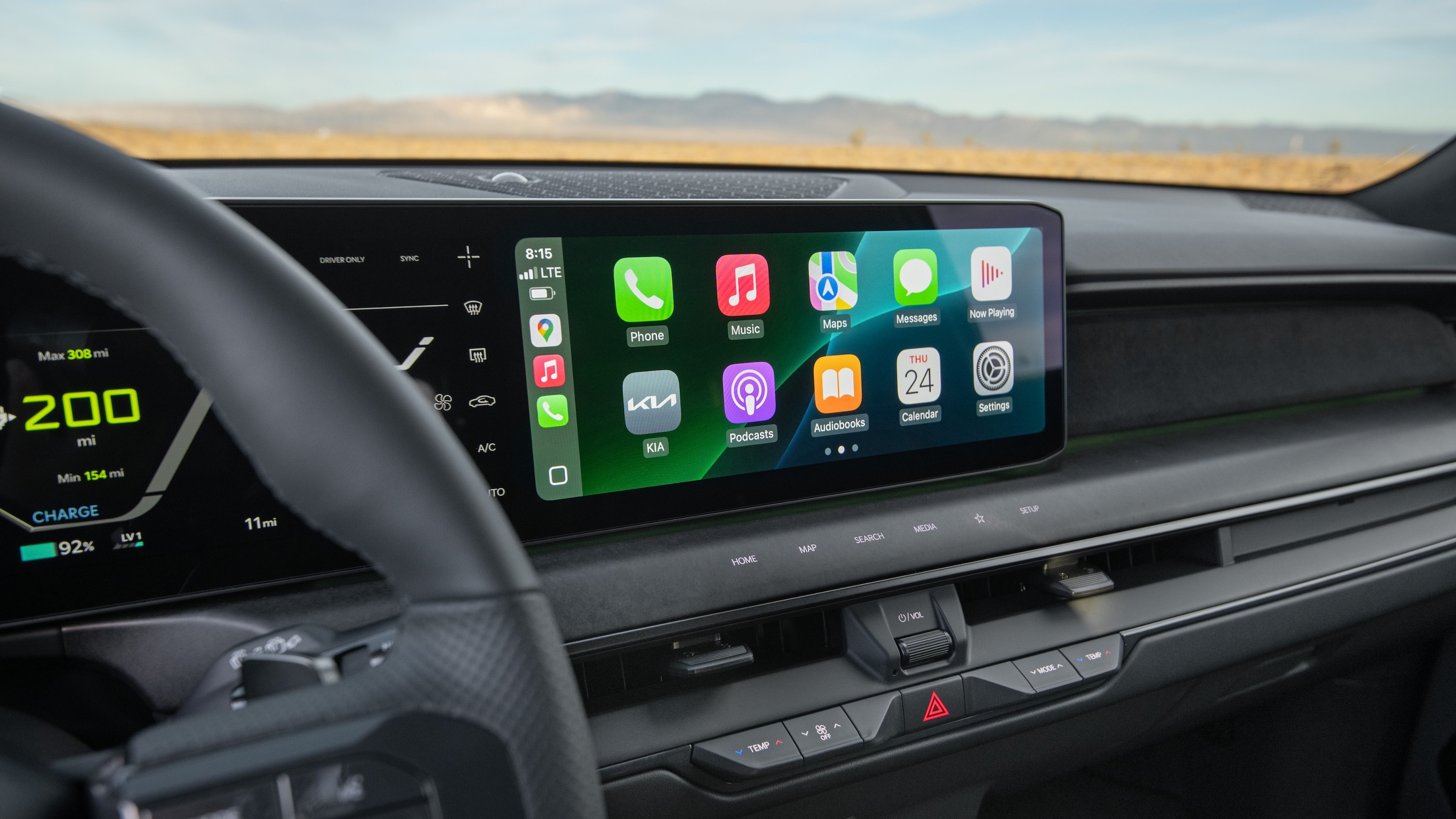 Apple CarPlay running on the wide dashboard touchscreen of a new electric SUV