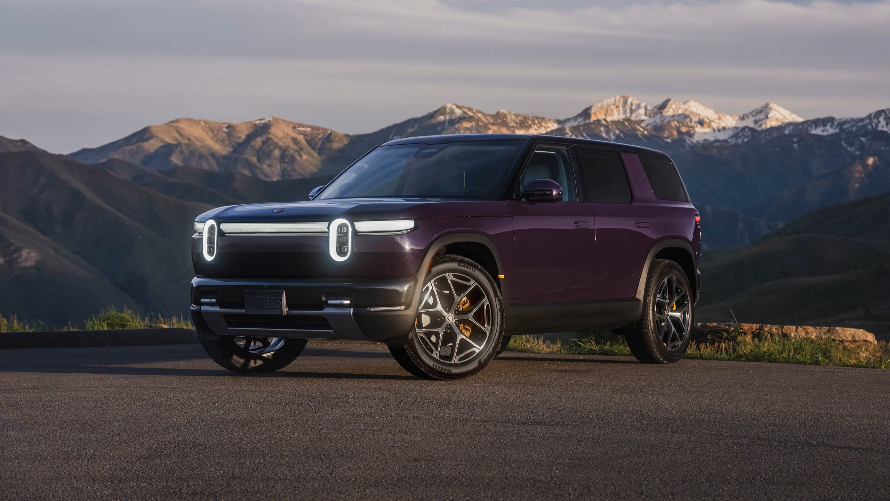 Rivian R2 Performance in Borealis purple paint on a Utah road