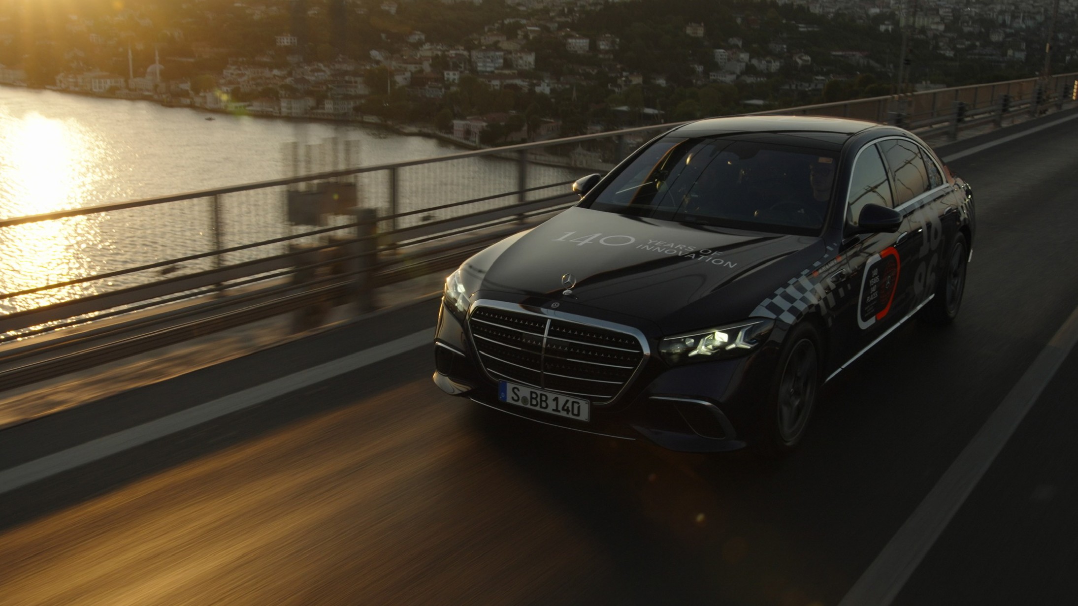 New Mercedes S-Class crossing the Bosphorus Bridge in Istanbul at sunset
