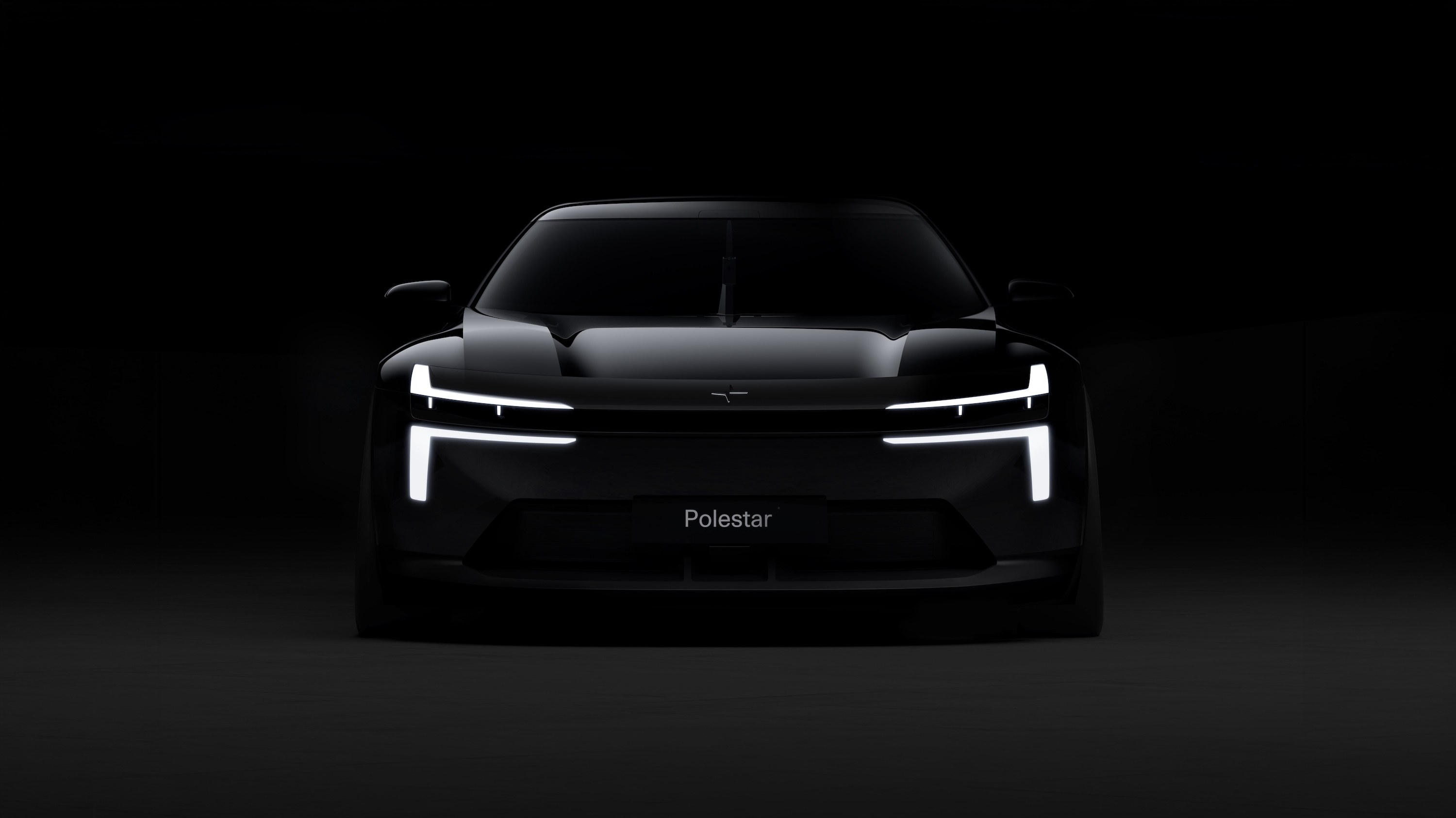 Polestar Formula 2030 concept head-on with Dual Blade headlights lit in the dark