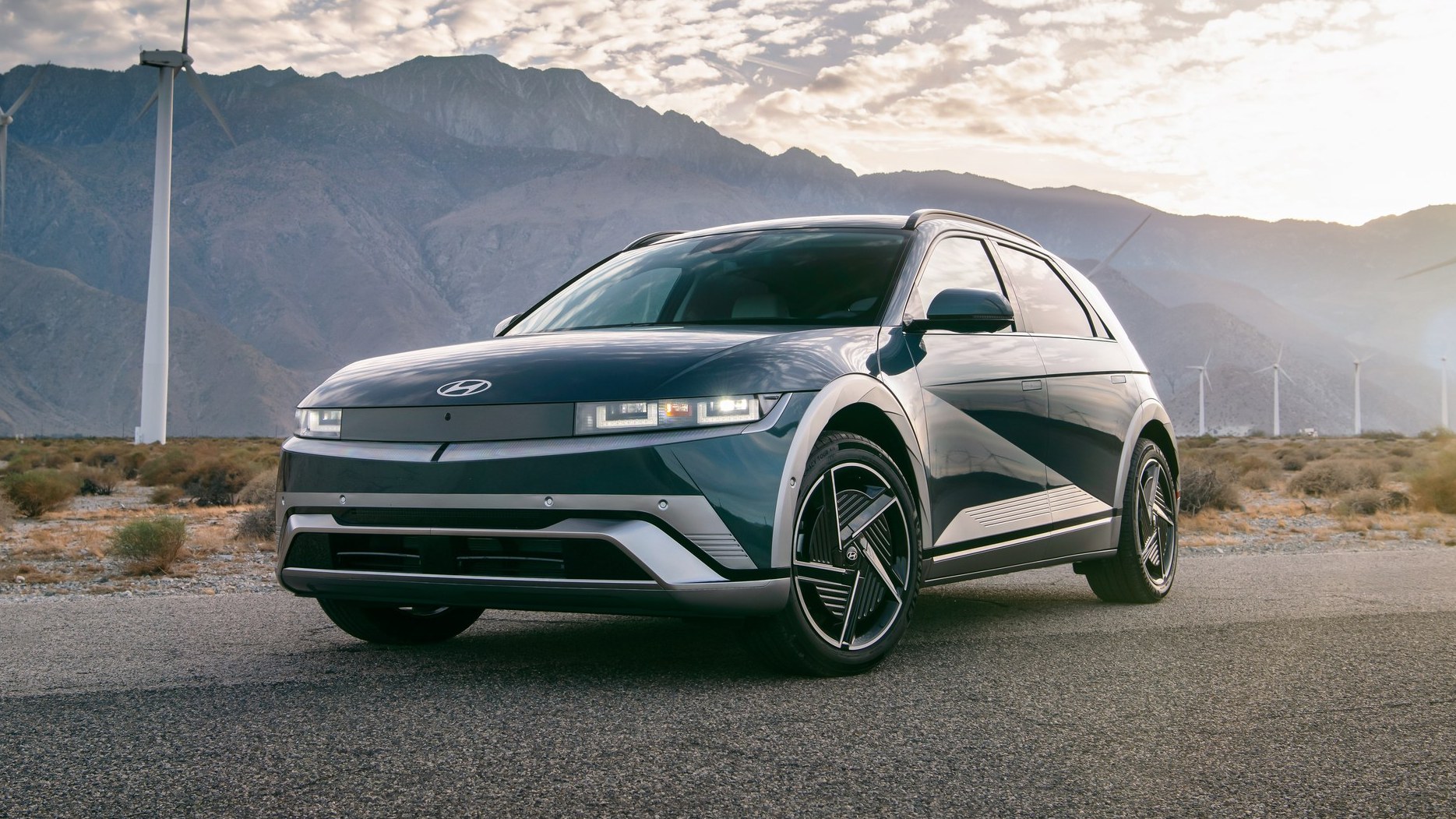 2026 Hyundai Ioniq 5 Limited parked in front of wind turbines