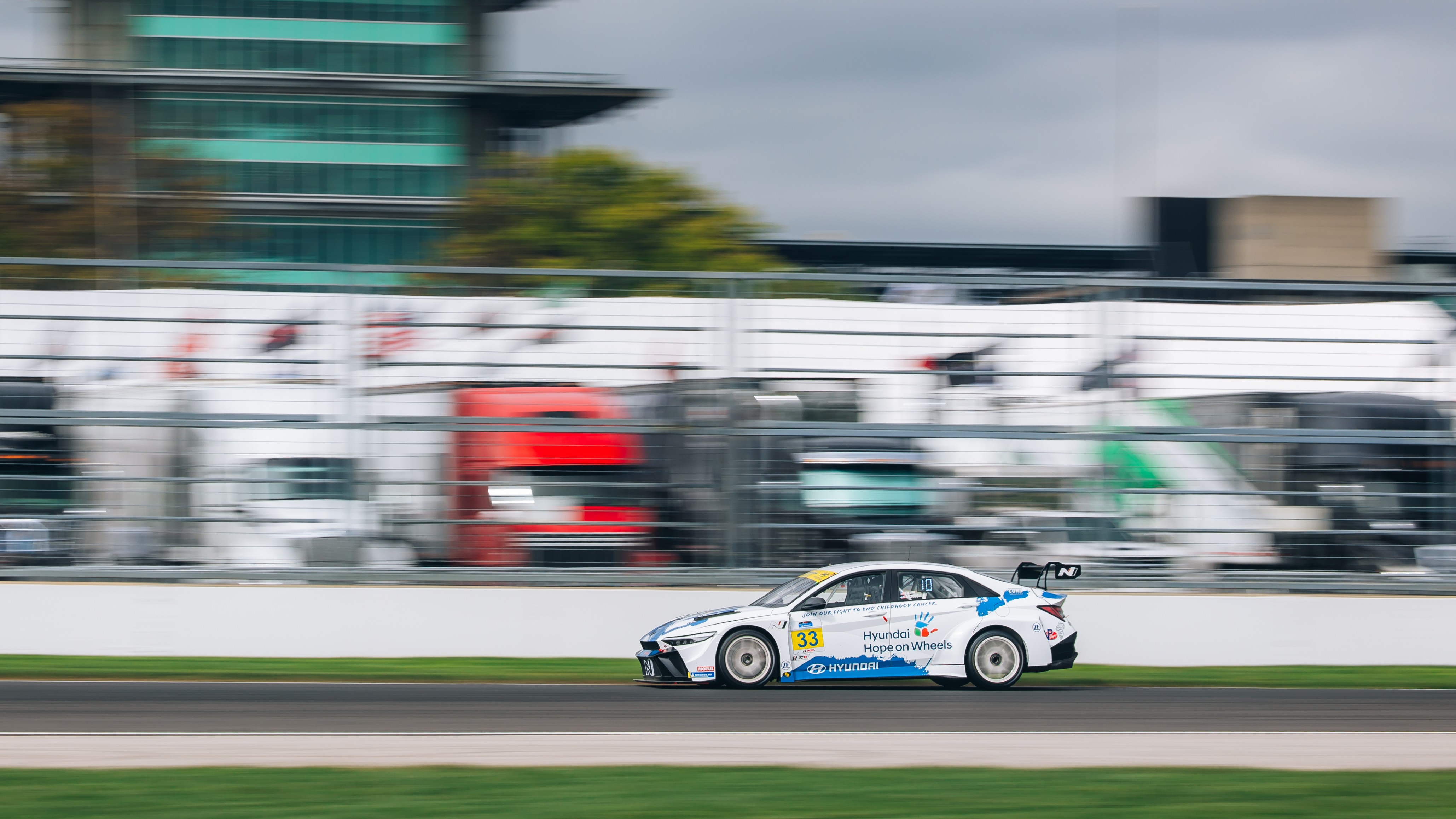 Hyundai Elantra N TCR No. 33 racing past the Indianapolis pagoda