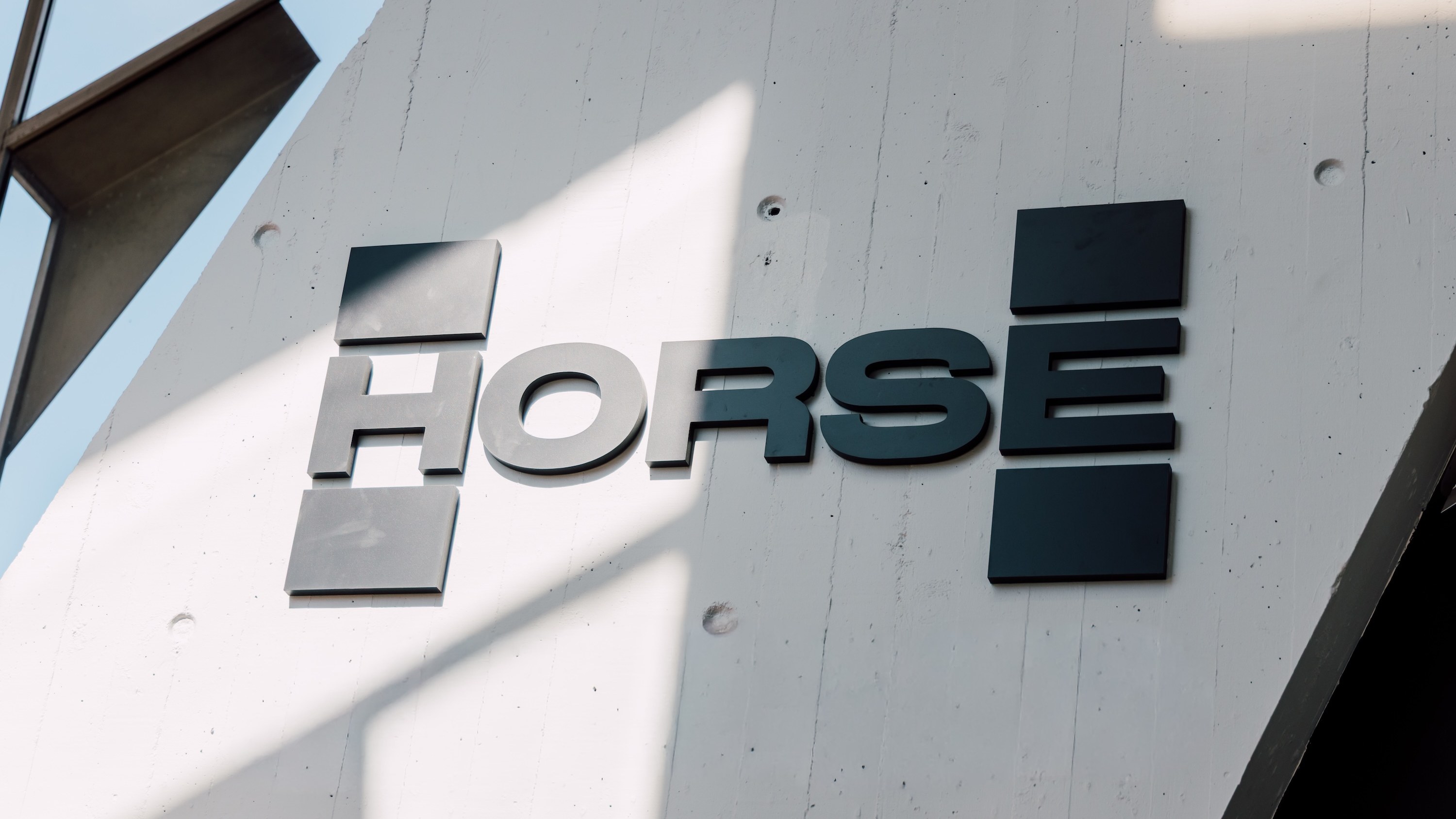 Horse Powertrain logo on the wall of its new Detroit-area office