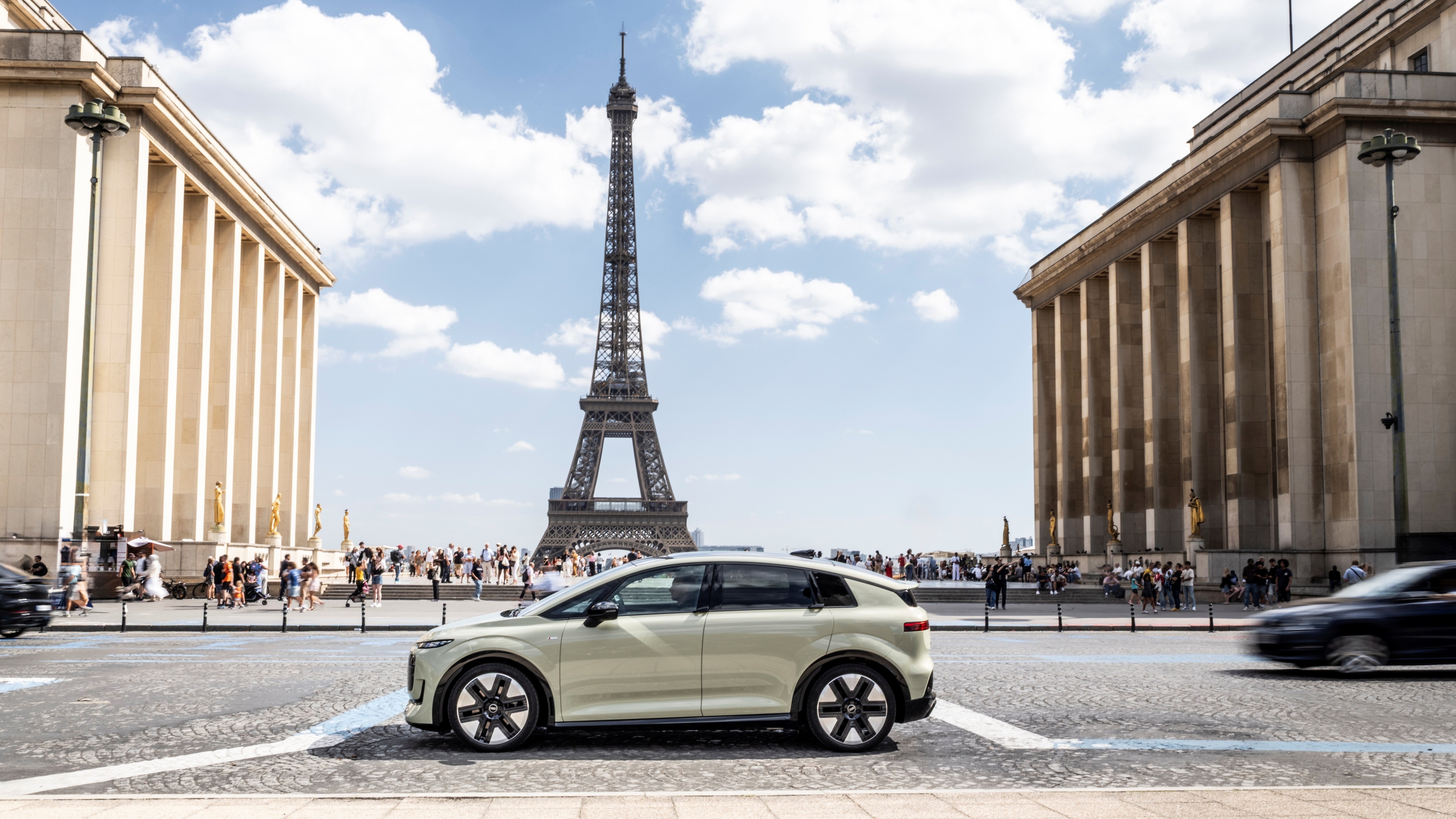 Audi A2 e-tron in pistachio green parked near the Eiffel Tower