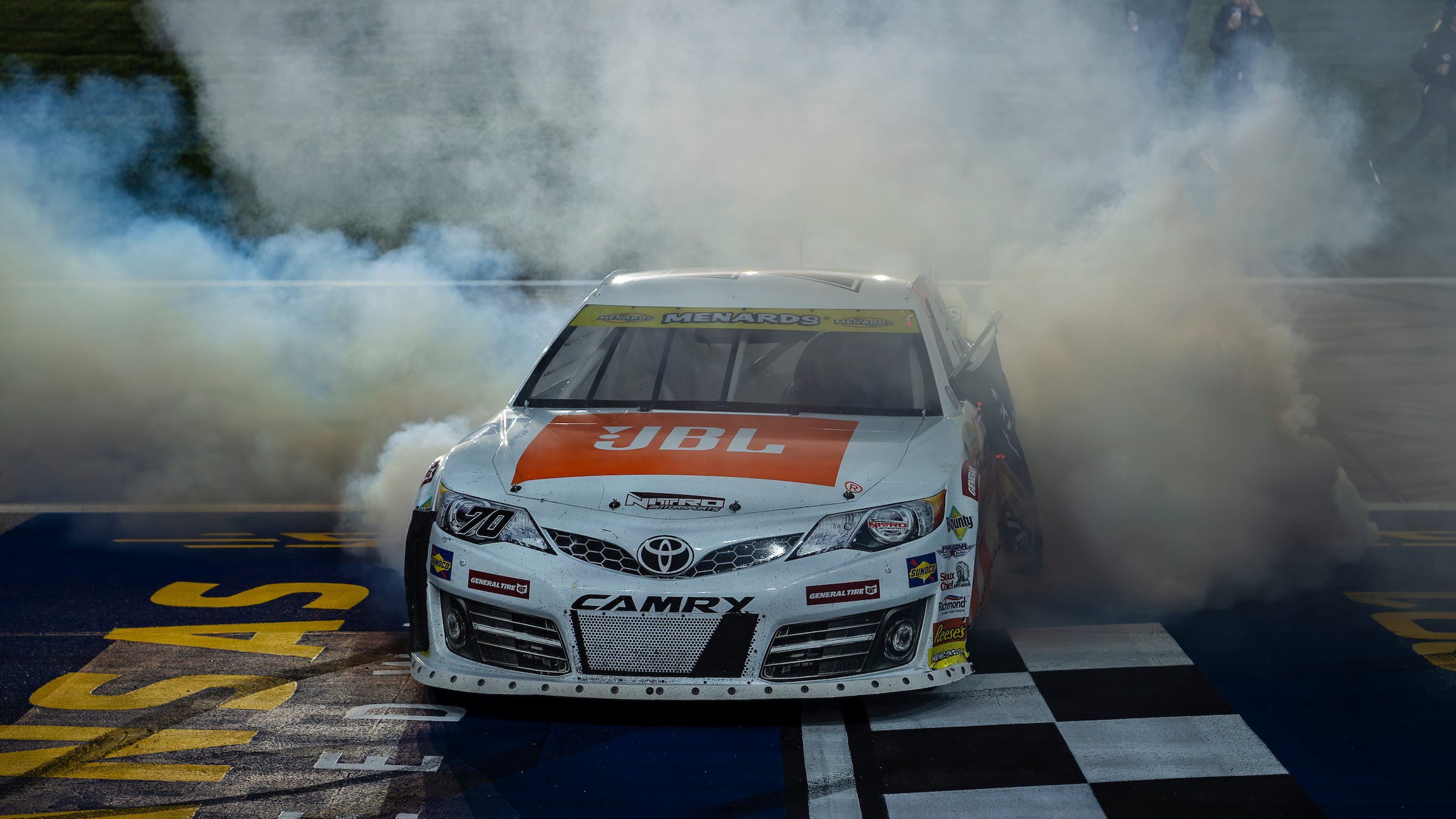 homas Annunziata's No. 70 Toyota Camry doing a burnout at Kansas Speedway