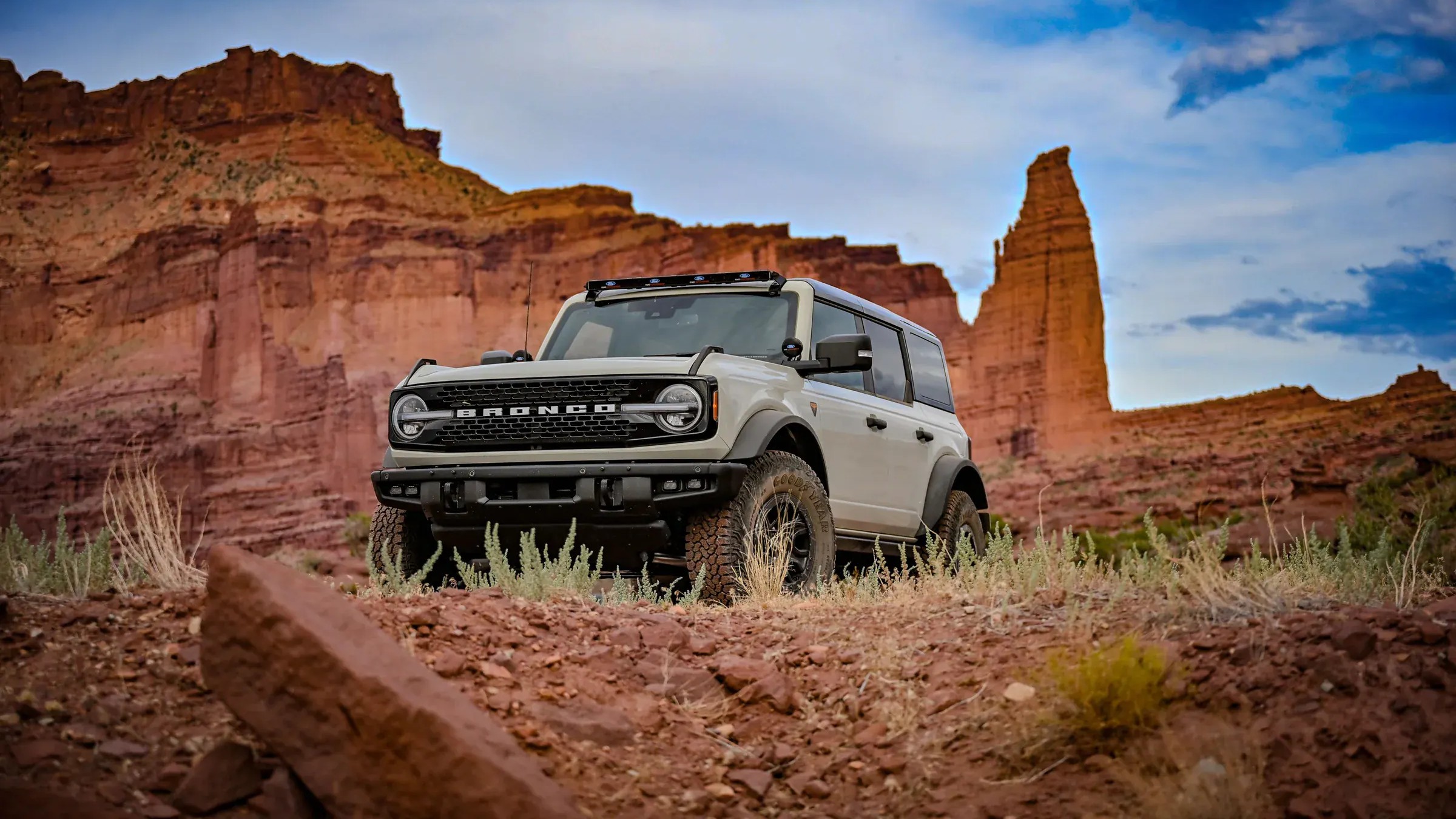 Ford Bronco four-door SUV, front three-quarter view on a desert trail