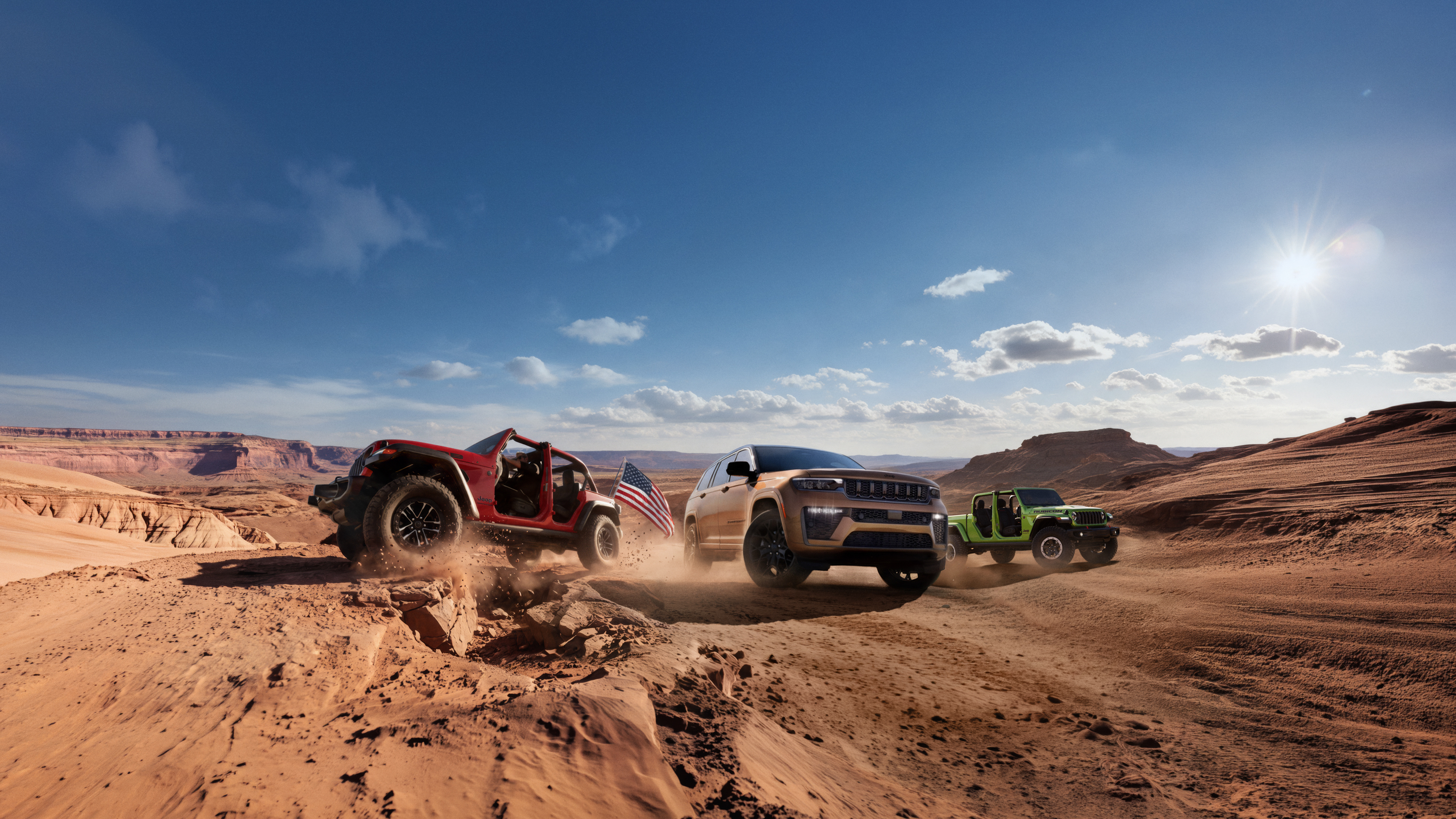 Jeep Wrangler, Grand Cherokee and Gladiator off-road with American flag