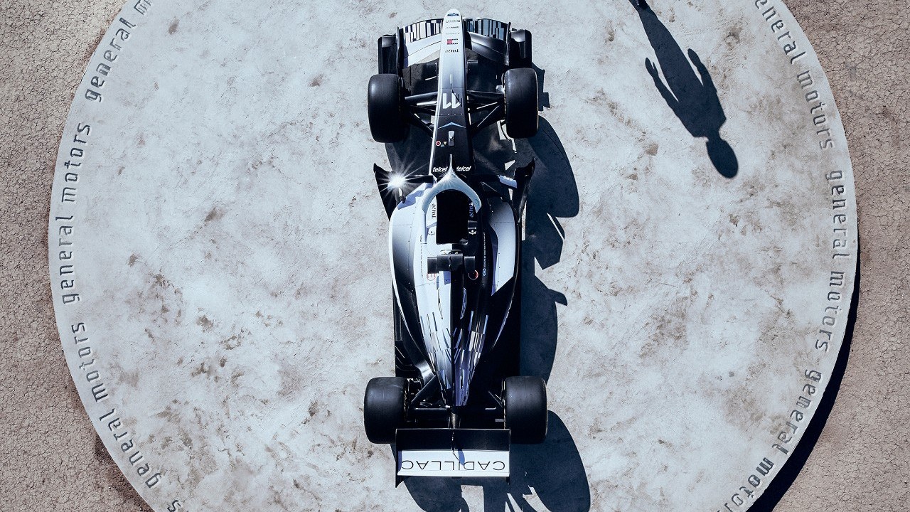 Overhead view of the Cadillac F1 car on a General Motors branded pad