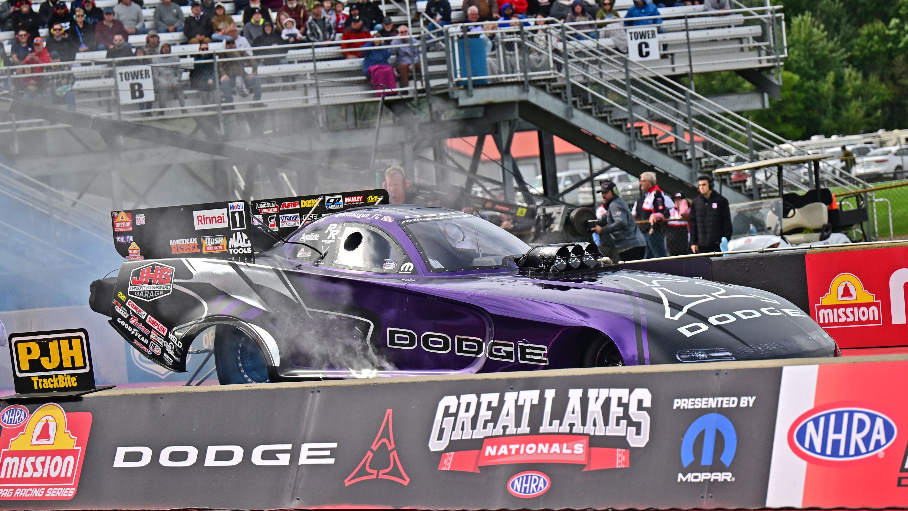 Matt Hagan's purple Dodge Funny Car doing a burnout at Great Lakes Nationals