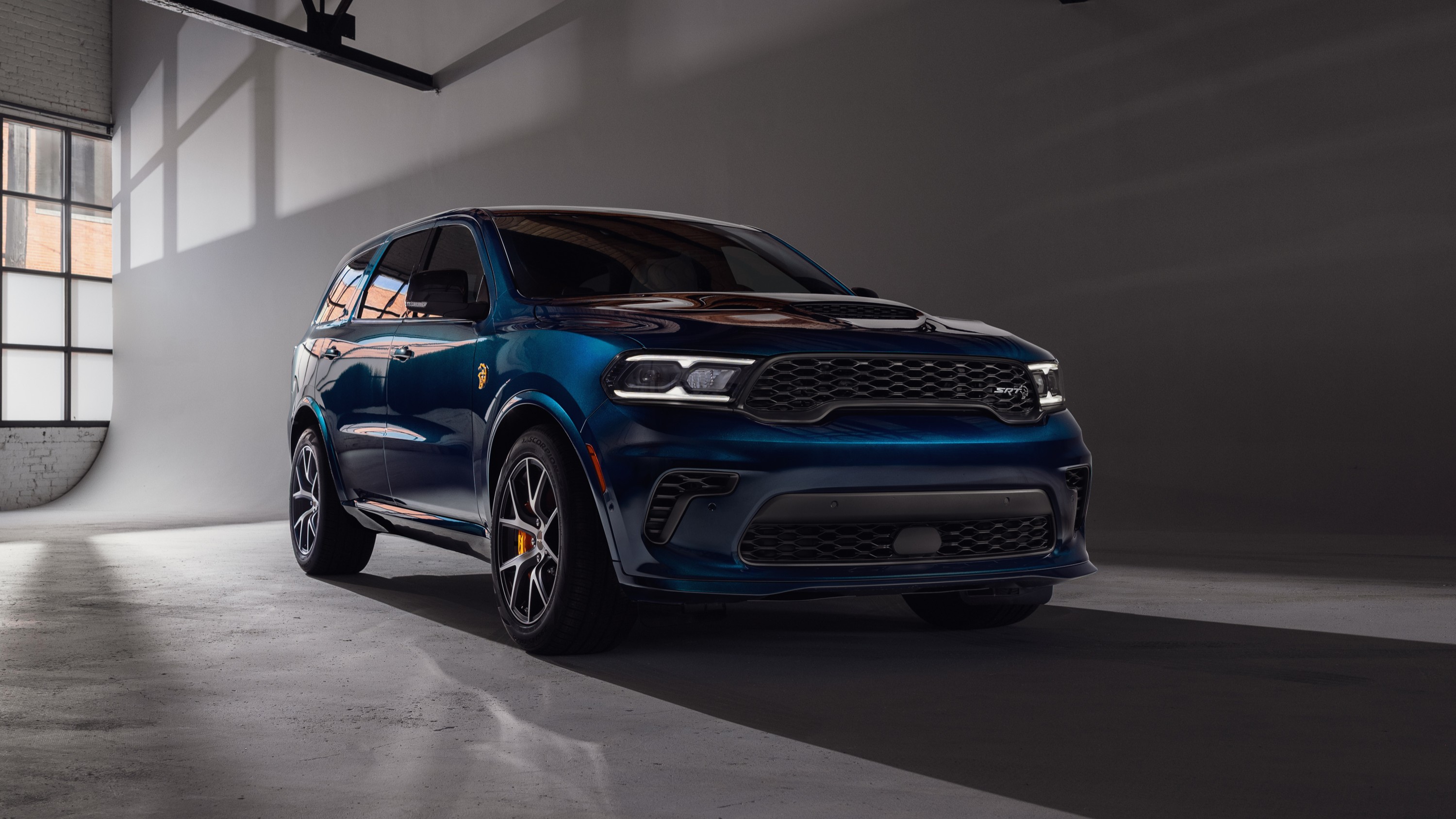 2027 Dodge Durango SRT Hellcat in After Dark deep metallic blue, front three-quarter view