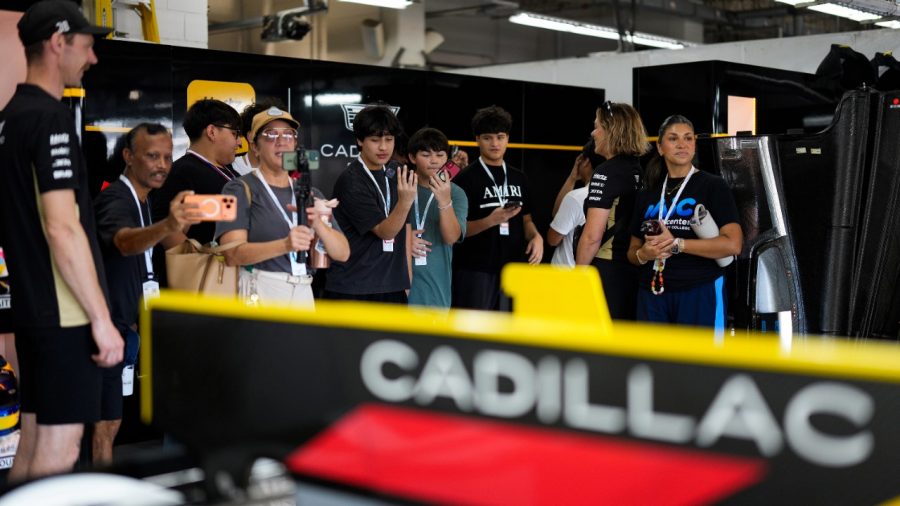 Students tour the Cadillac garage during the Lone Star Le Mans weekend at COTA