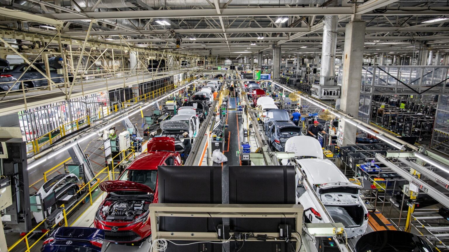 Toyota Corolla sedans moving down the assembly line in Blue Springs, Mississippi