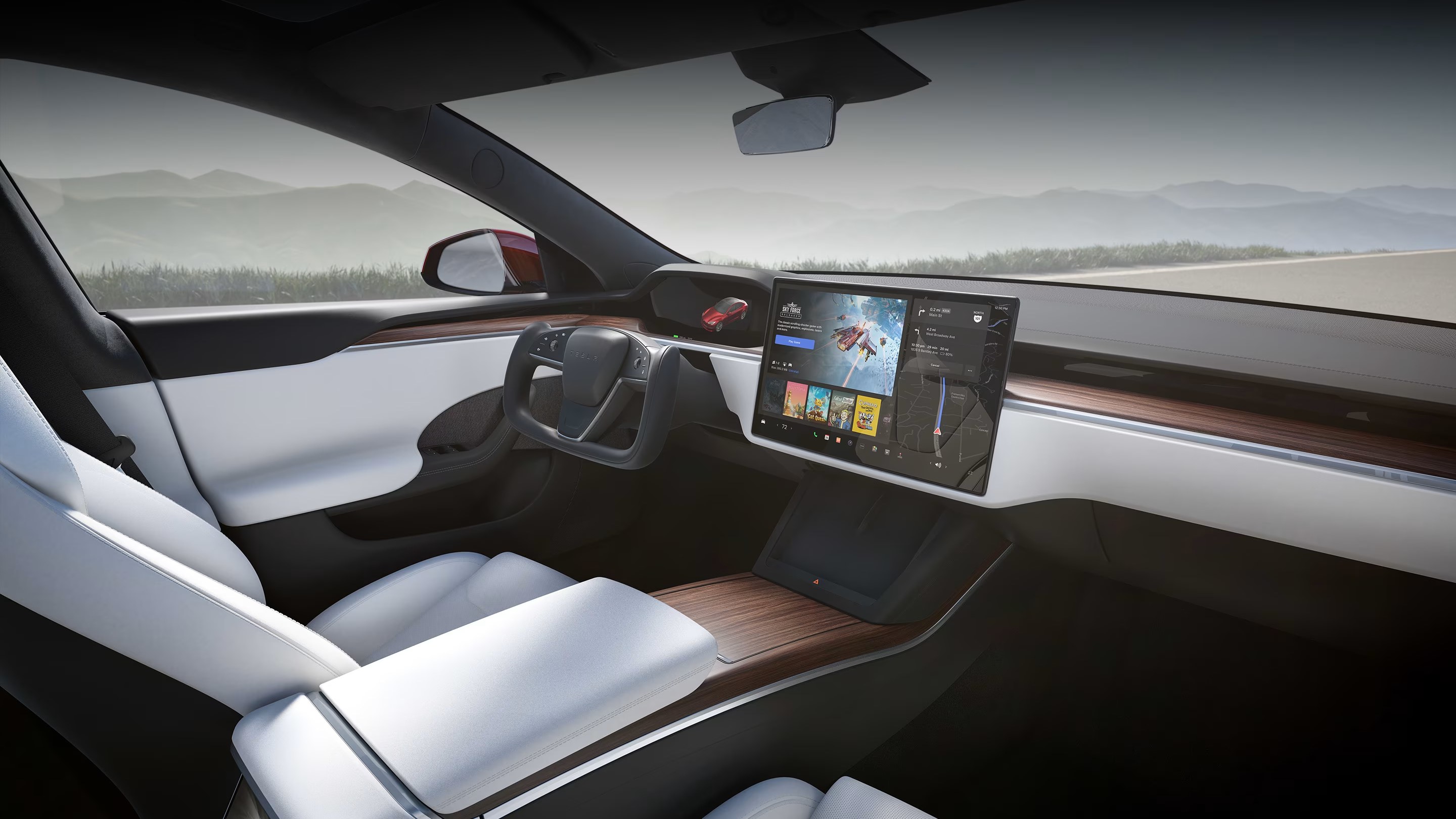 Tesla Model S interior with steering yoke and central touchscreen