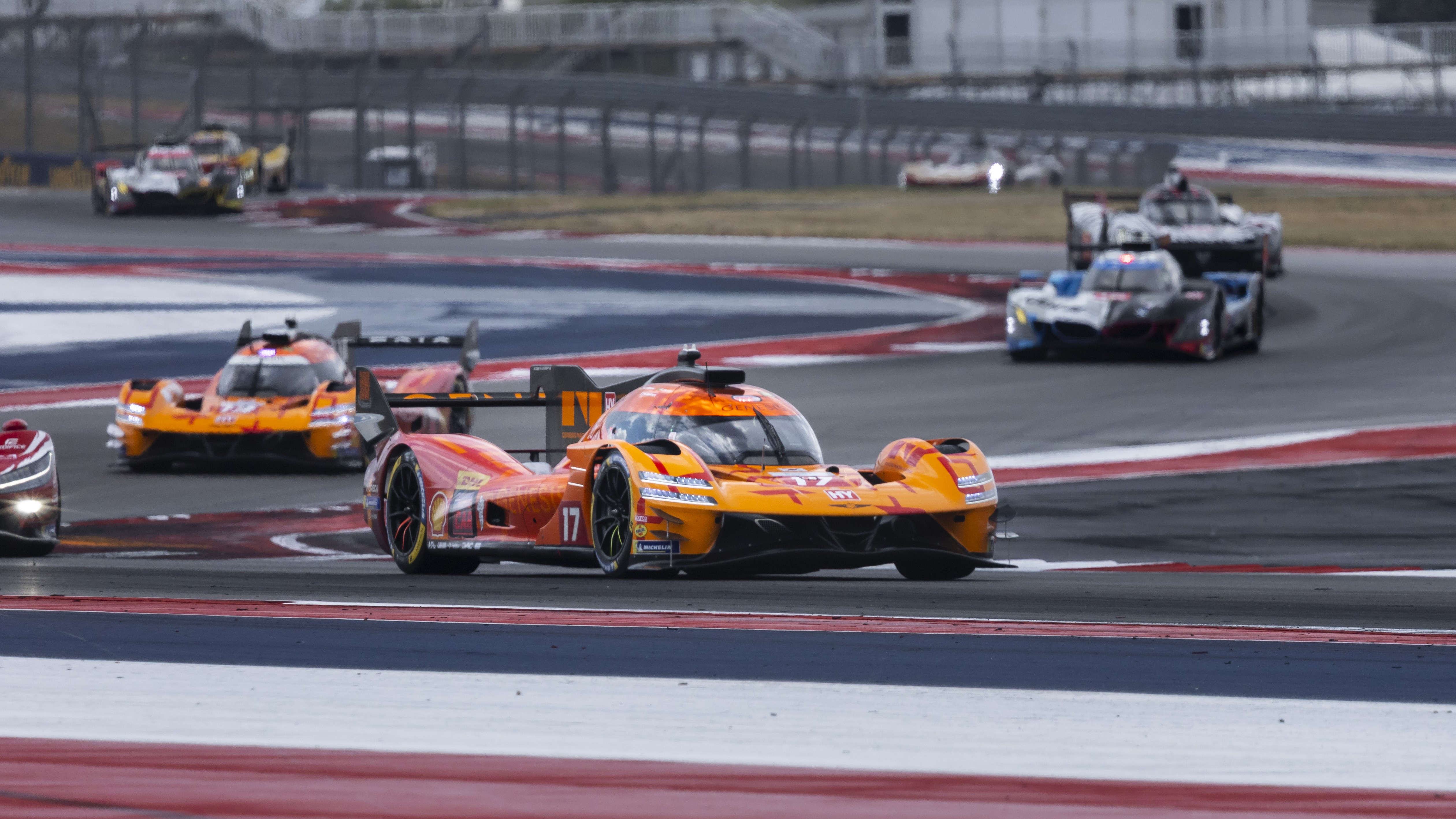 Genesis GMR-001 Hypercar leading a pack of cars at Circuit of the Americas