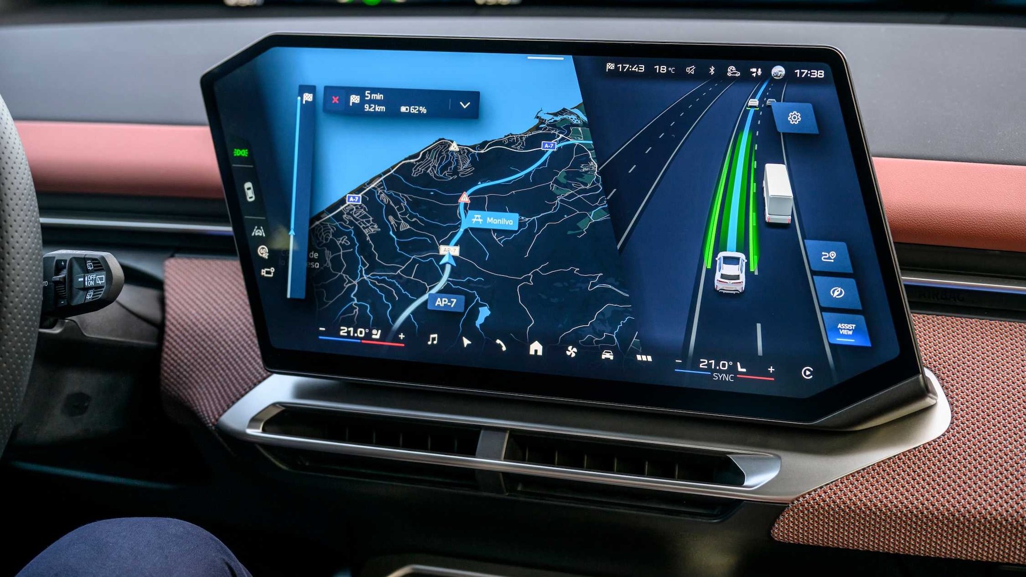 New BMW iX3 50 xDrive driving on a highway with Highway Assistant active