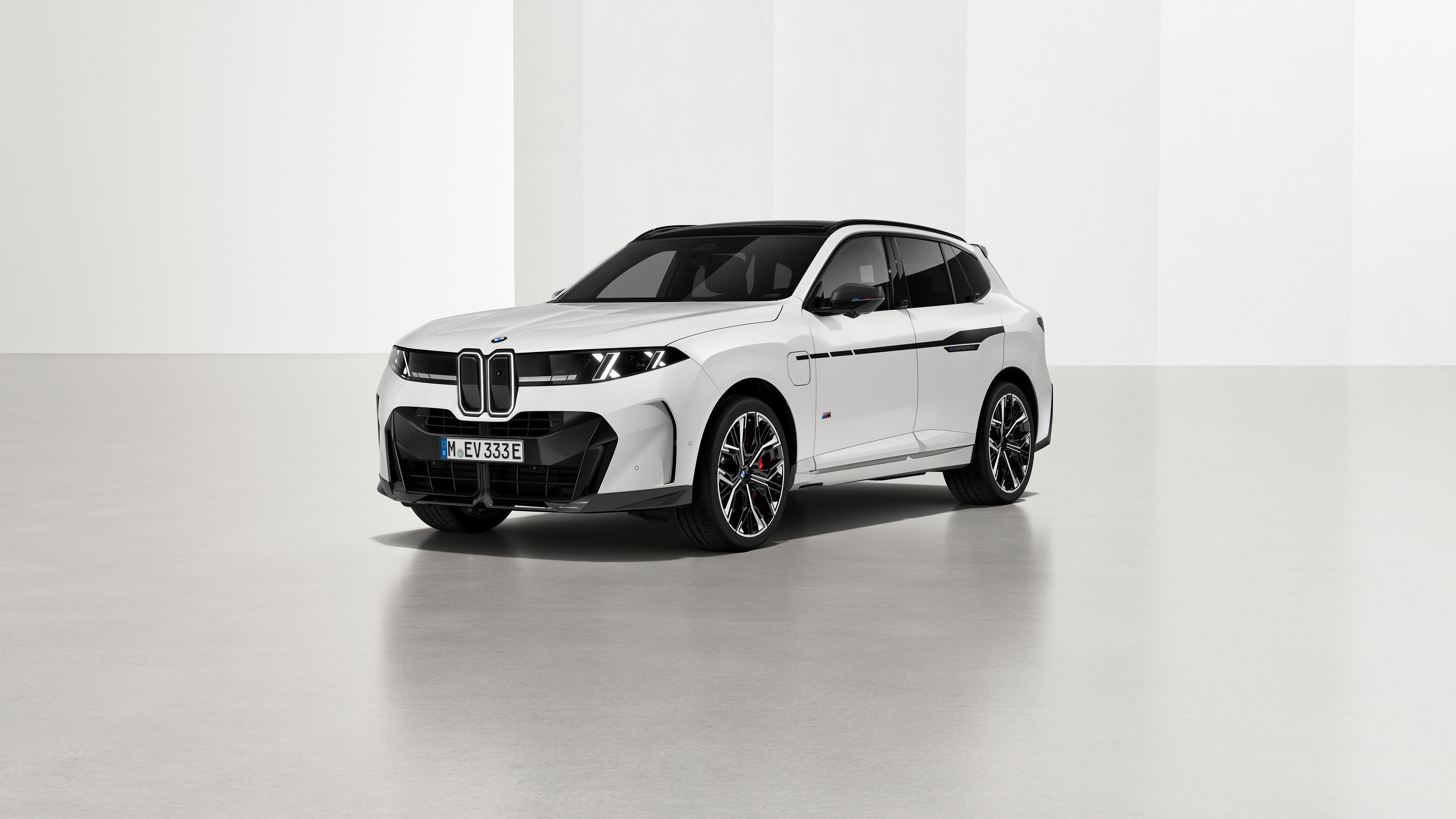 BMW X5 with M Performance Parts, front three-quarter studio view
