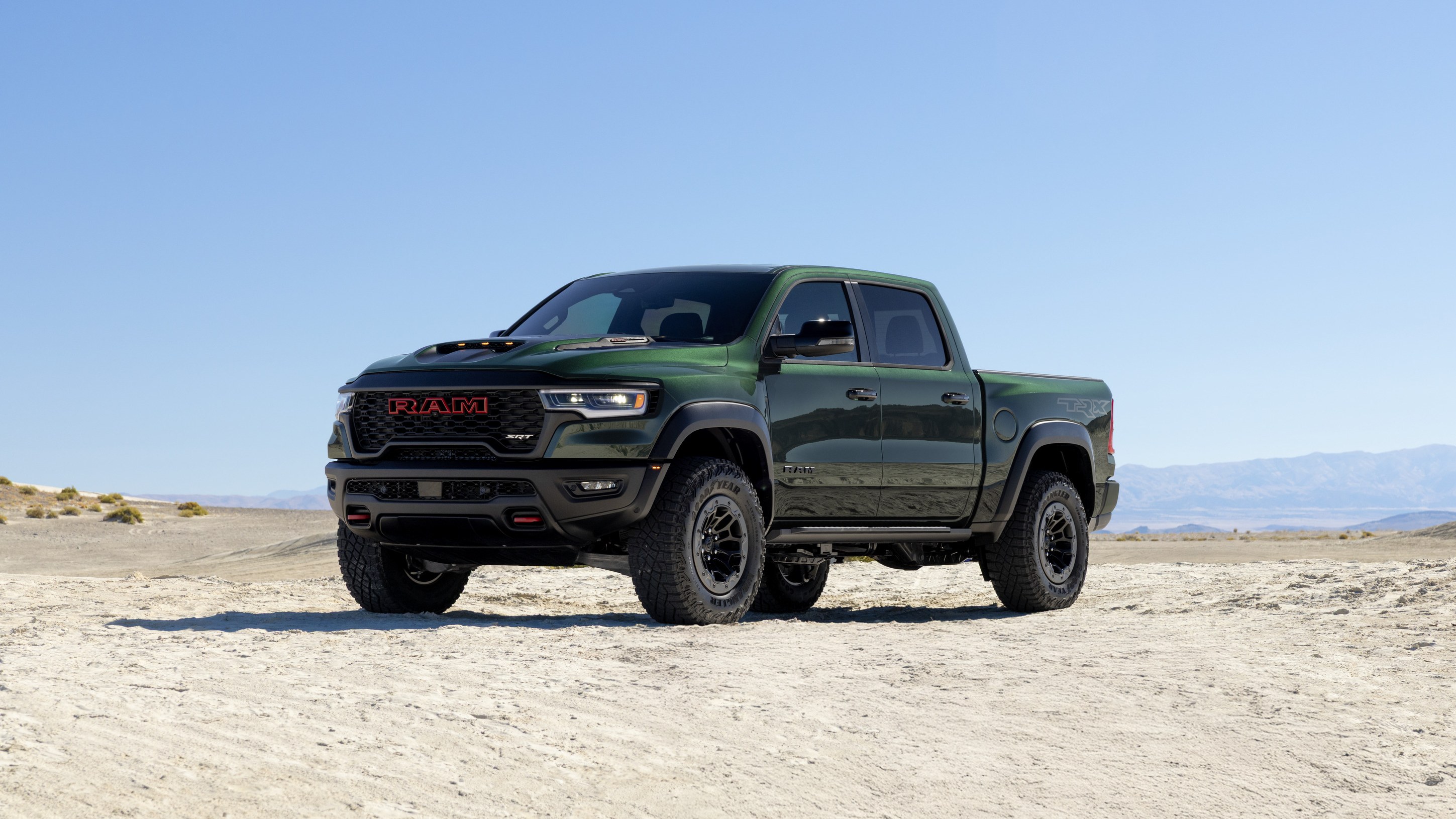 2027 Ram 1500 TRX SRT in dark green on a desert lakebed
