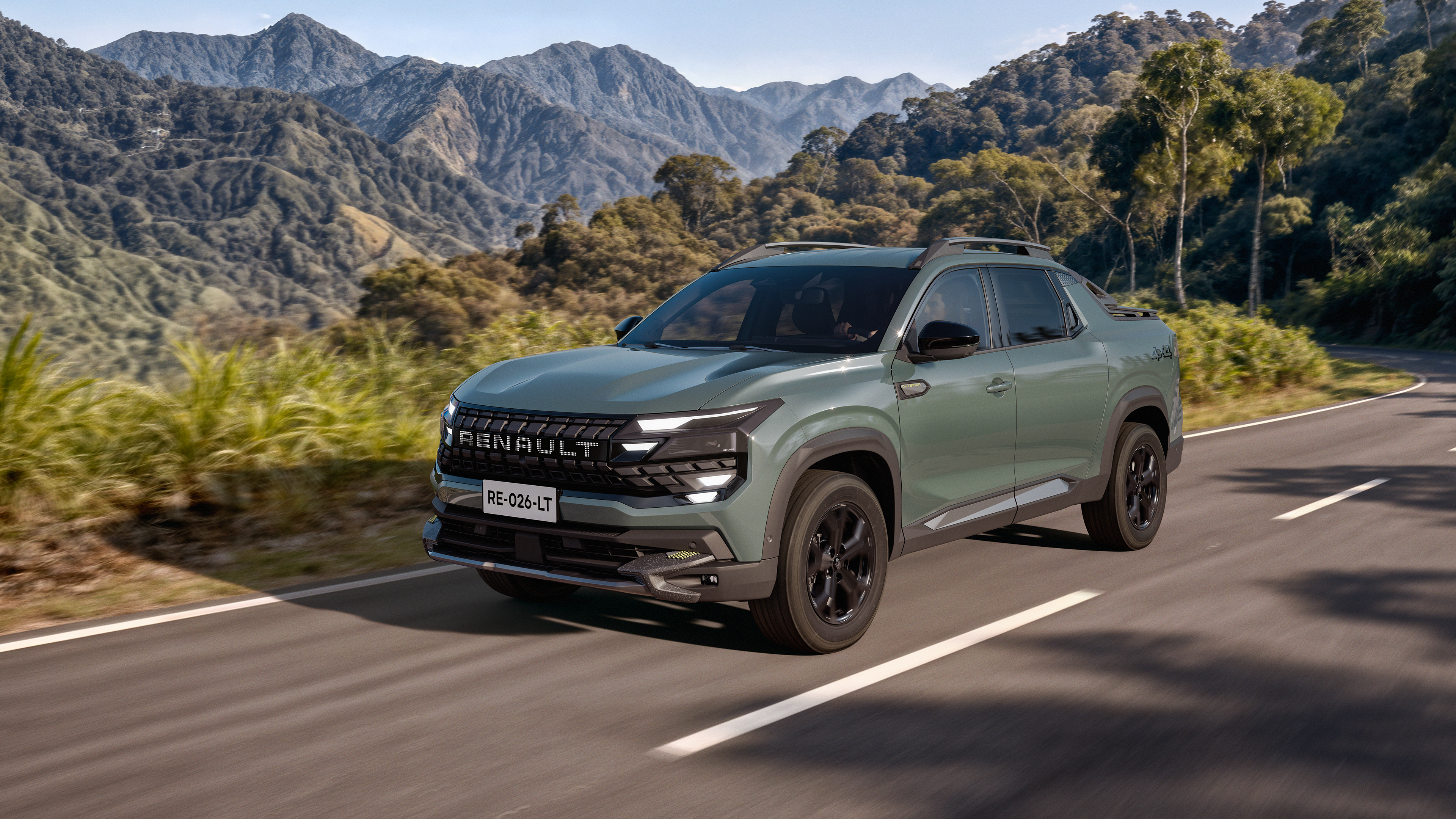 Renault Niagara compact pickup driving on a mountain road, front three-quarter view
