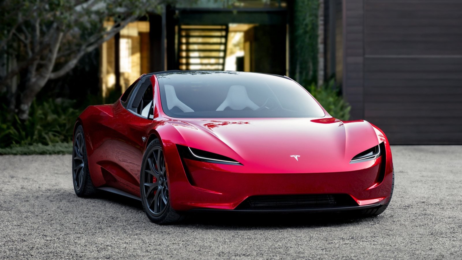 Red 2017 Tesla Roadster prototype, front view on a gravel driveway