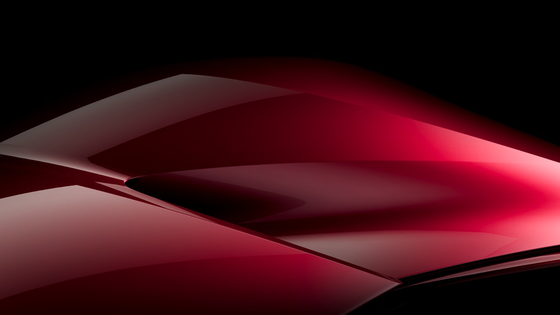 Teaser image of the red Alfa Romeo concept car's sculpted bodywork