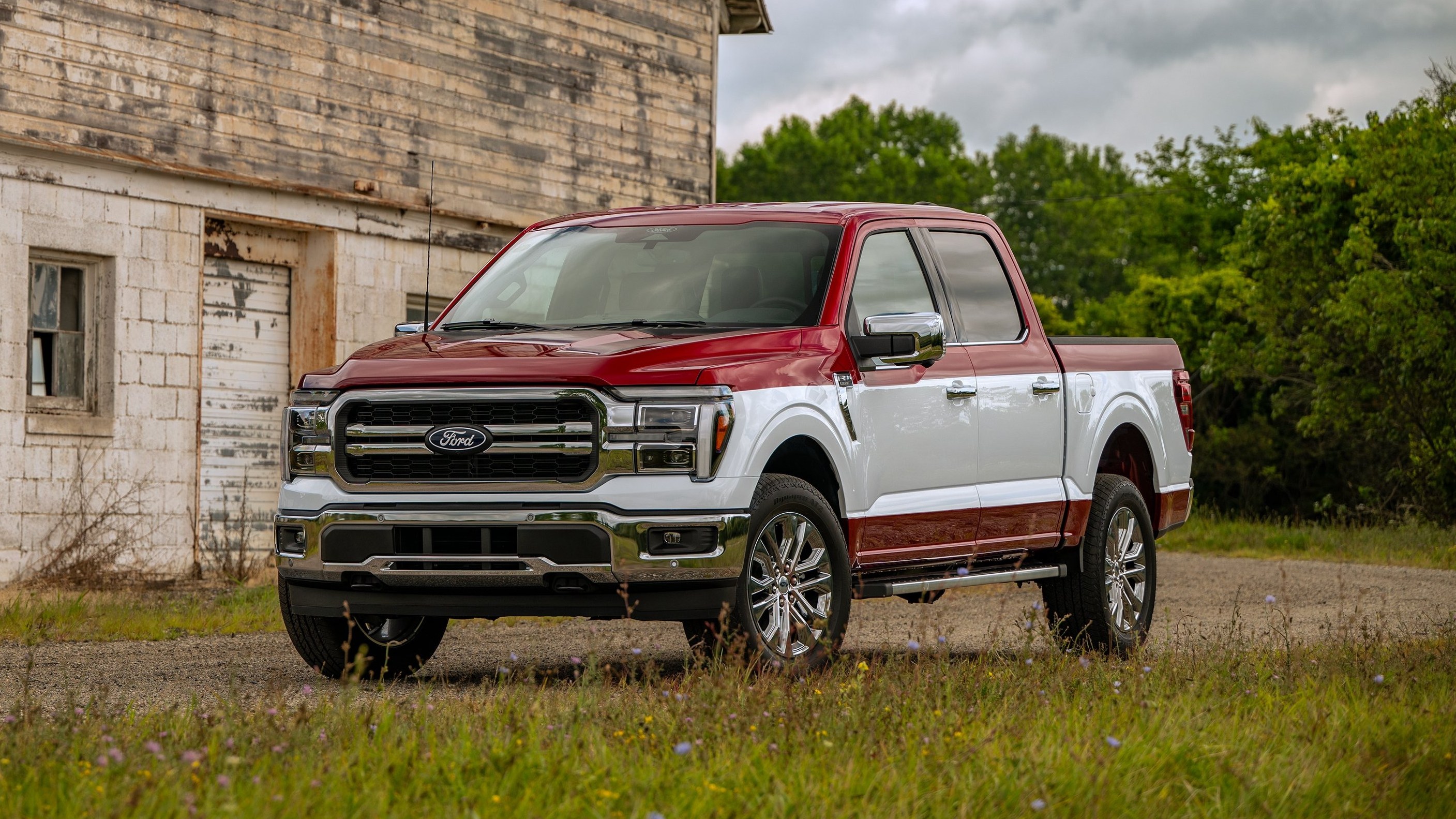 2027 Ford F-150 Two-Tone Package in red with Oxford White band, front three-quarter view