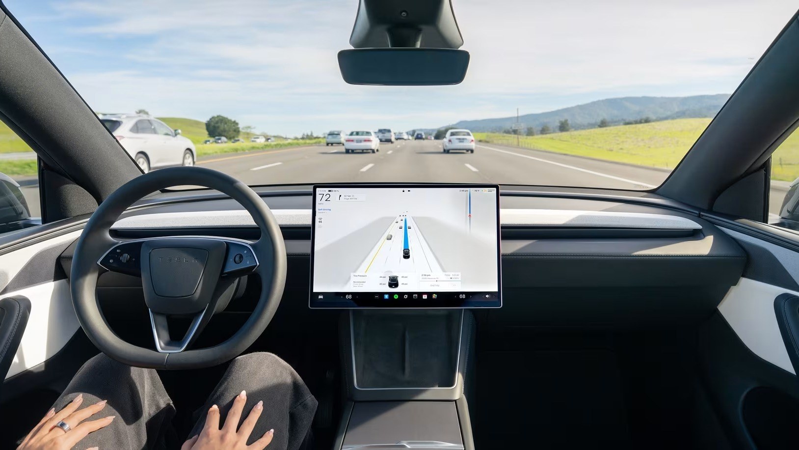 Tesla Model 3 interior with Full Self-Driving visualization on the center screen
