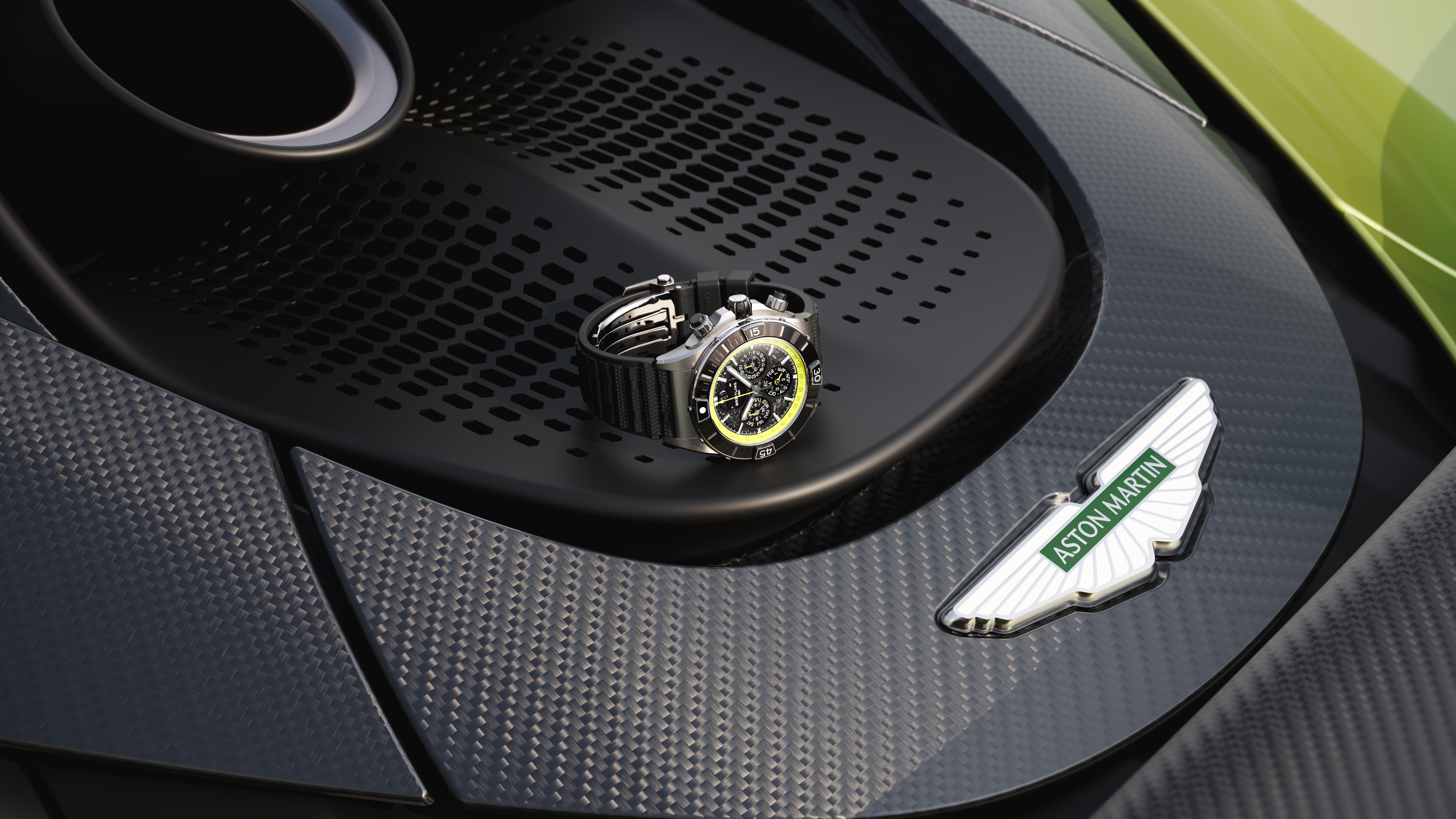 Breitling Super Chronomat B19 44 on the exhaust panel of a green Aston Martin Valhalla