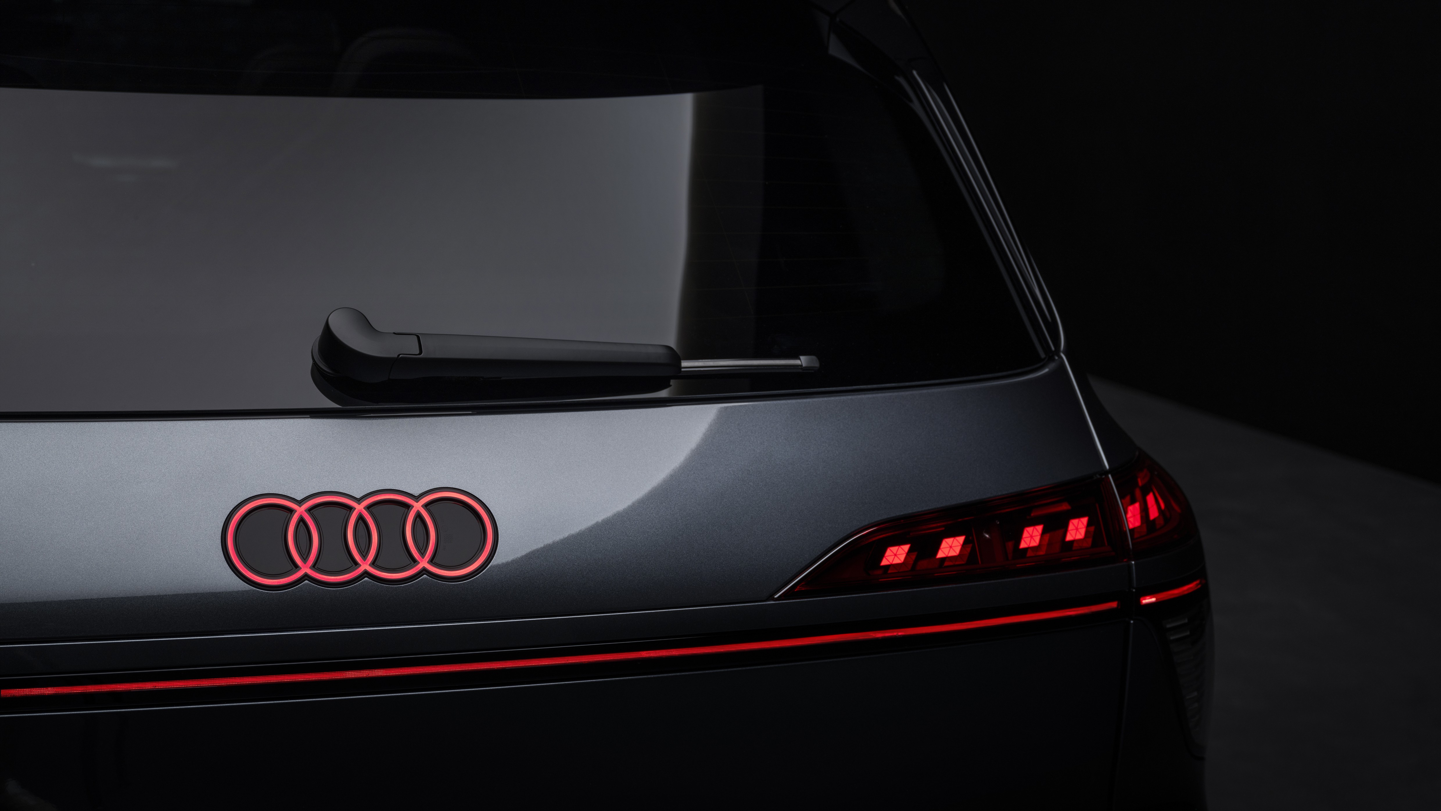Rear detail of the 2027 Audi SQ9 with illuminated rings and OLED taillight