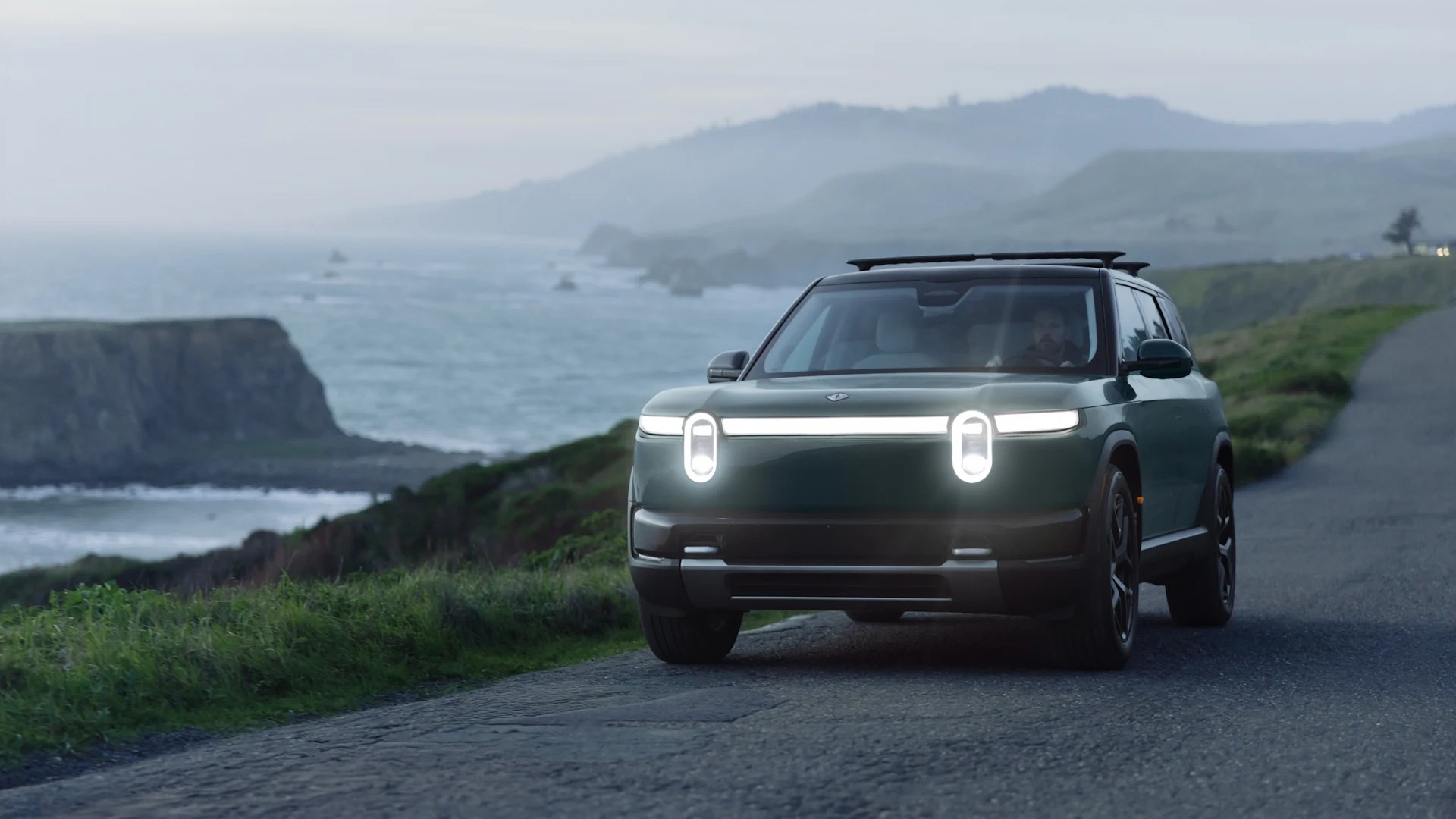 Rivian R2 in Catalina Blue showing its front lighting