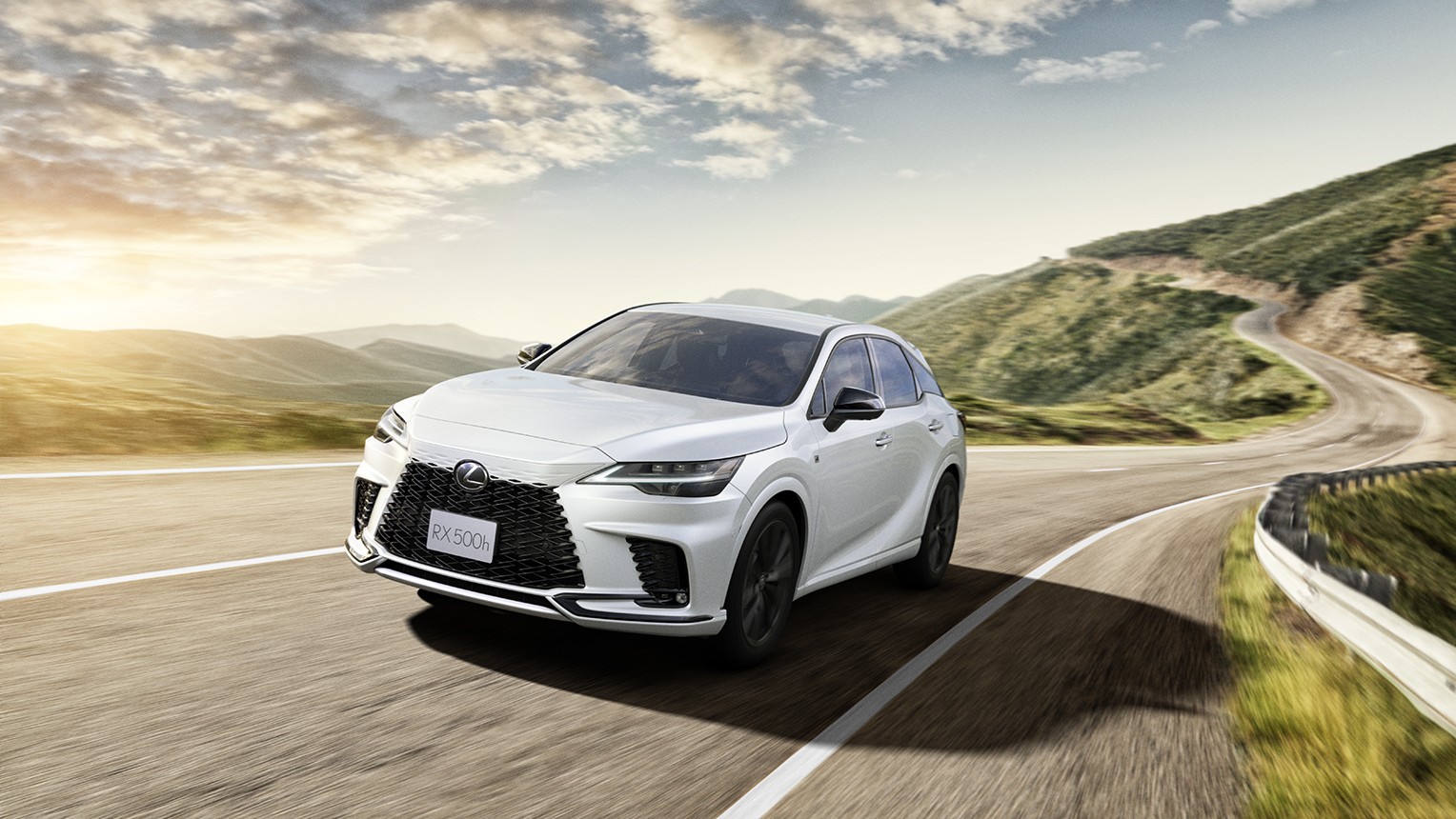 Lexus RX 500h F SPORT Performance in white on a winding mountain road
