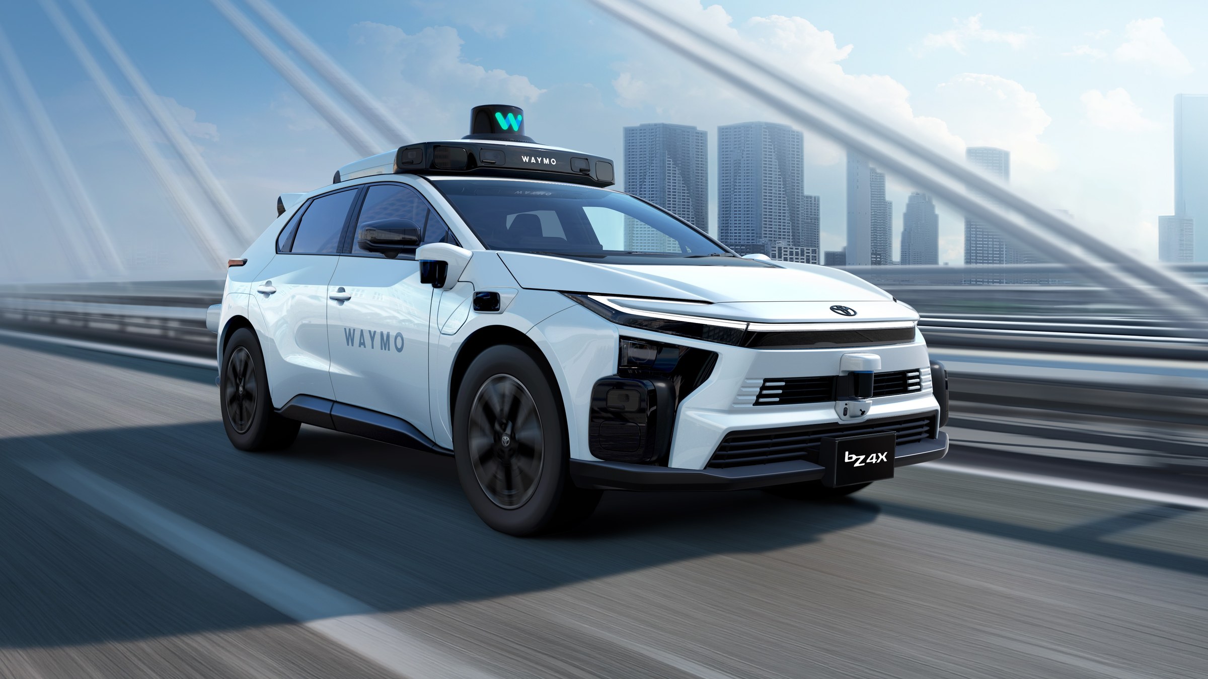Toyota bZ4X robotaxi with Waymo sensors driving on a bridge