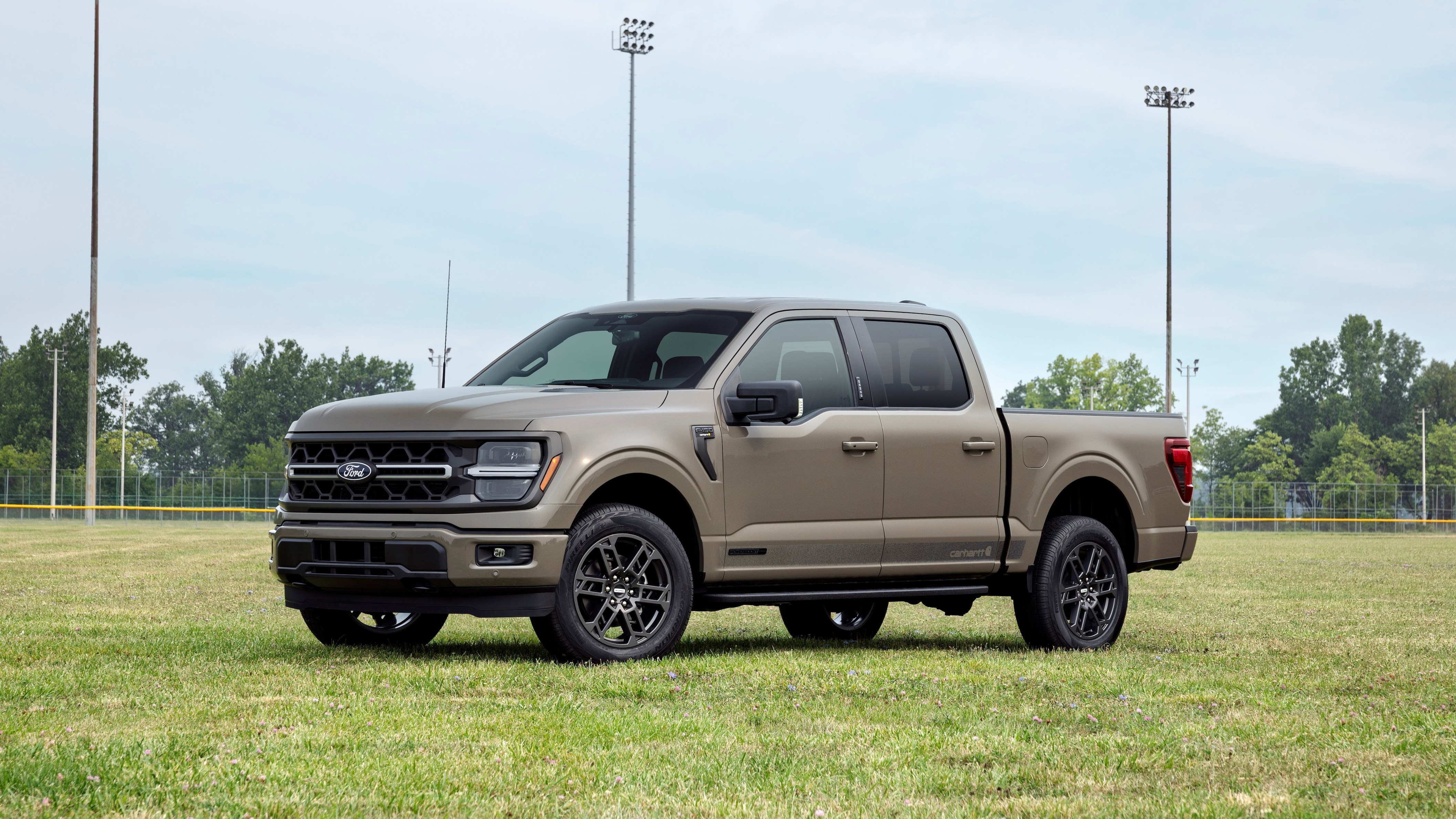 2027 Ford F-150 Carhartt parked on a baseball field