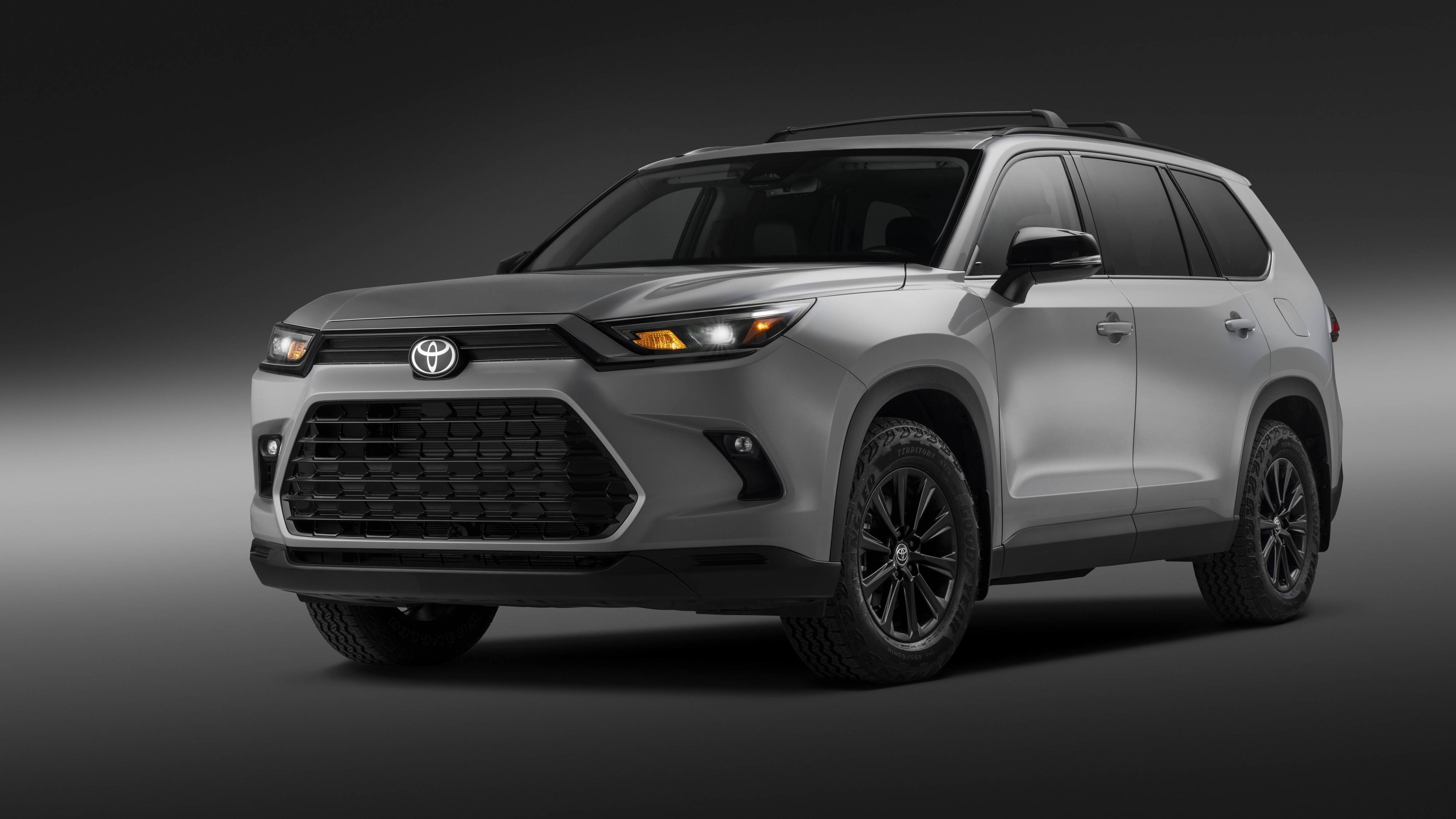 Silver 2027 Toyota Grand Highlander Woodland Edition, front three-quarter view
