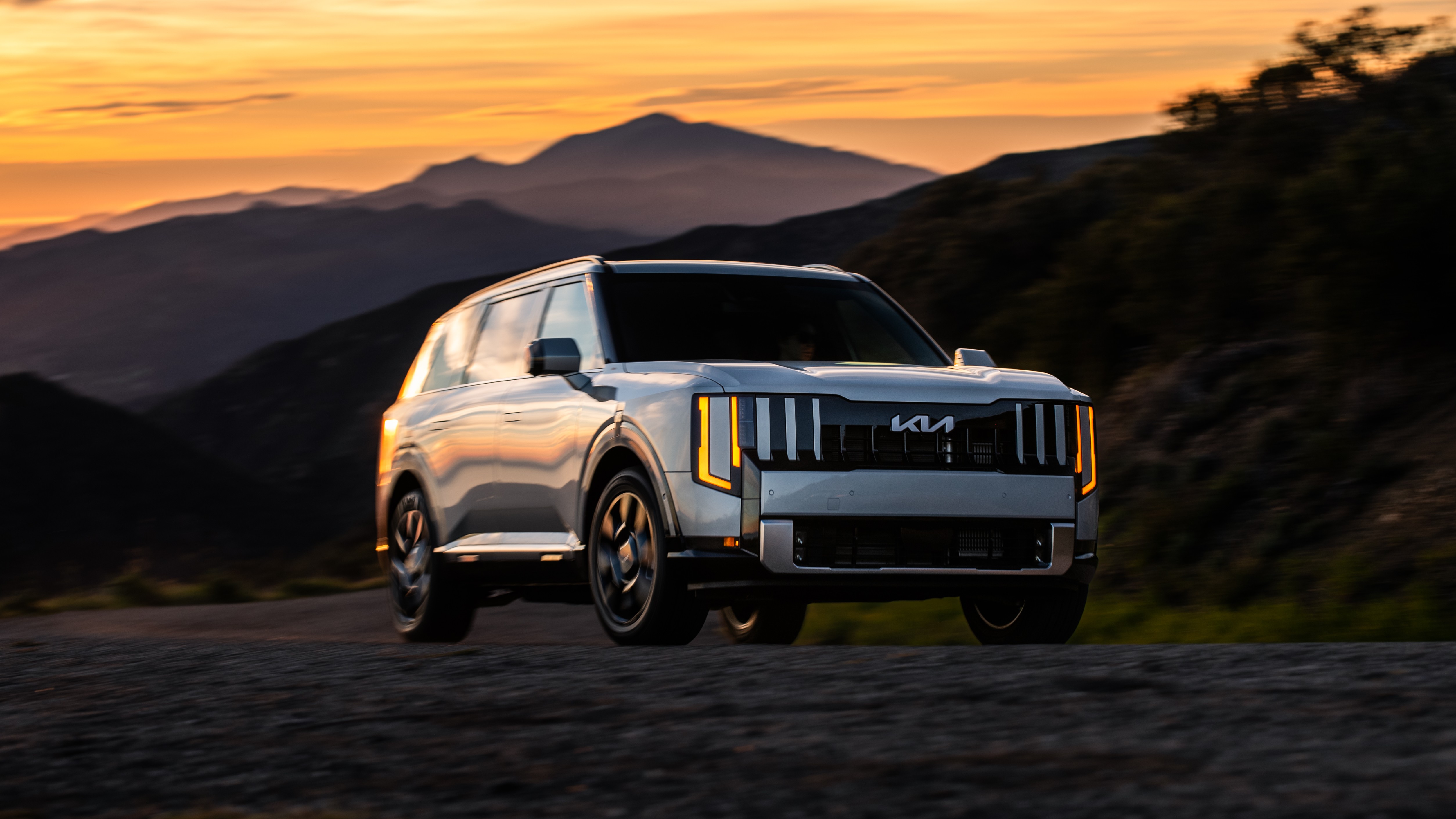 2027 Kia Telluride Hybrid SX-Prestige parked on a mountain road at sunset