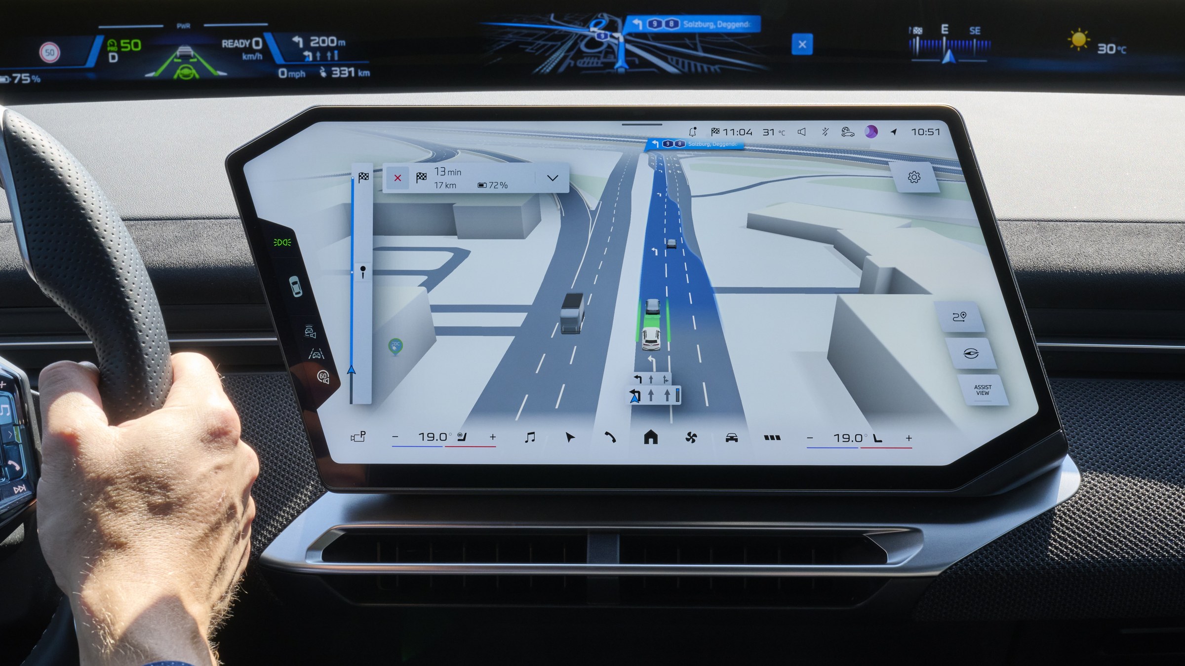 BMW center display showing 3D lane-level route guidance on a highway