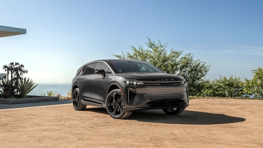 Dark gray Lucid Gravity electric SUV, front three-quarter view, parked outdoors