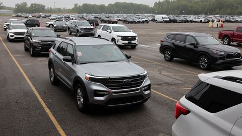 Rows of used vehicles lined up before a sale at the Manheim Detroit auction