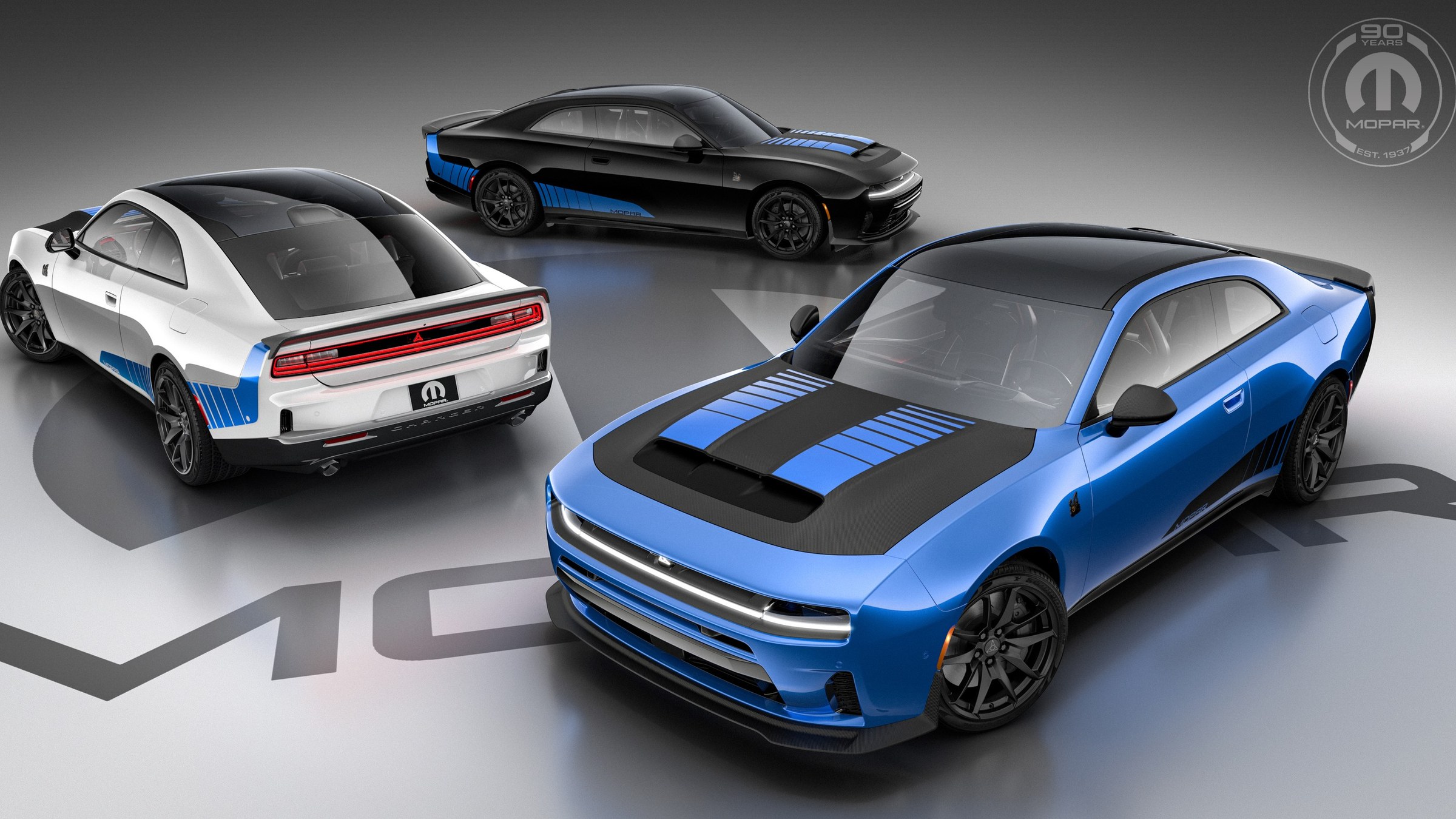 Three Mopar '27 Dodge Charger coupes in blue, white, and black