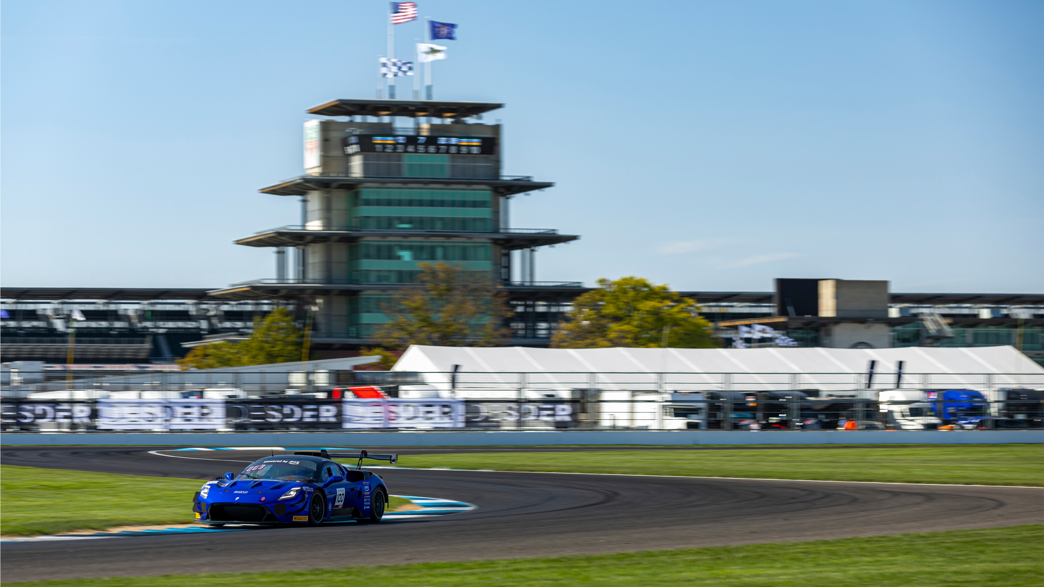 Maserati GT2 race car cornering at Indianapolis Motor Speedway with the Pagoda behind