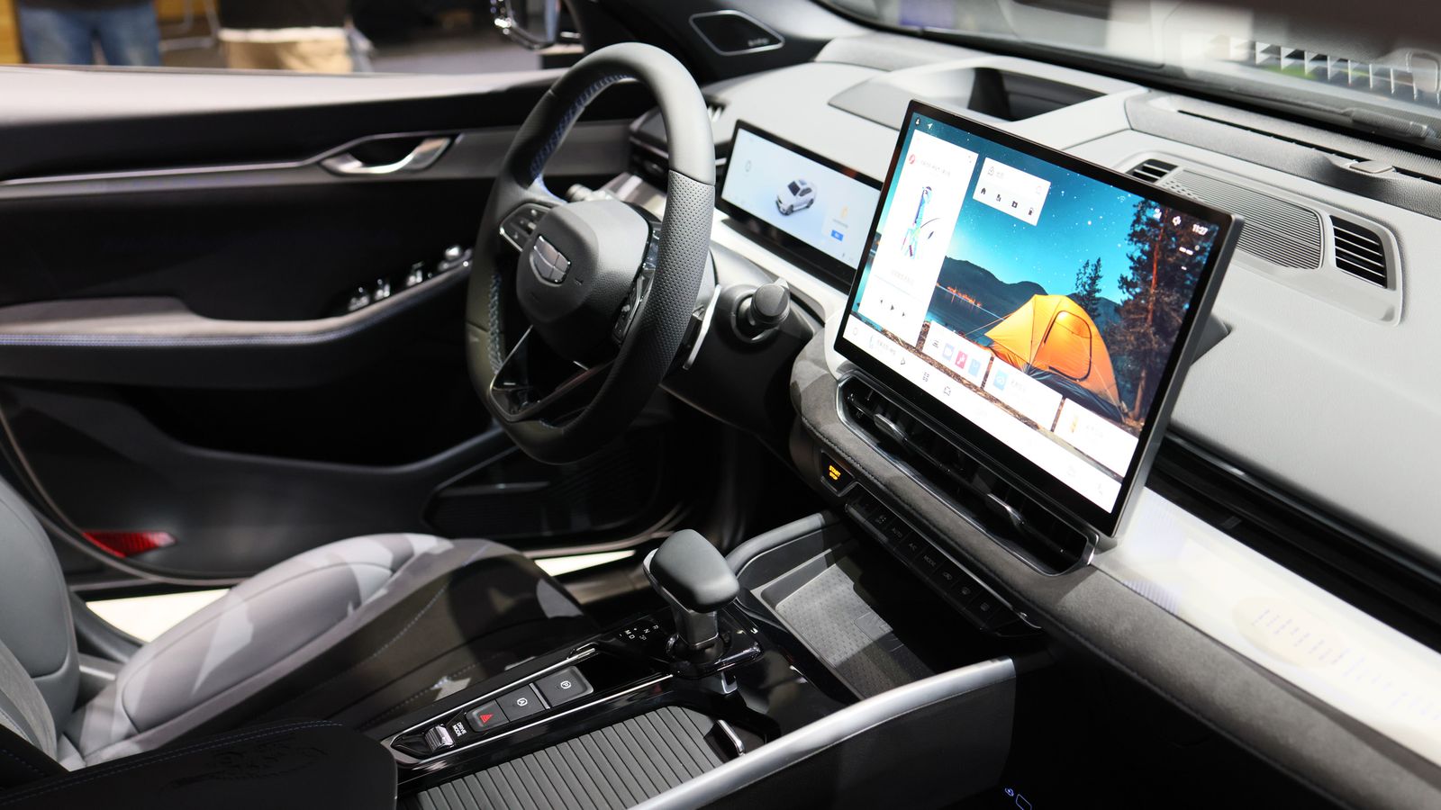 Car interior with a large center touchscreen infotainment display