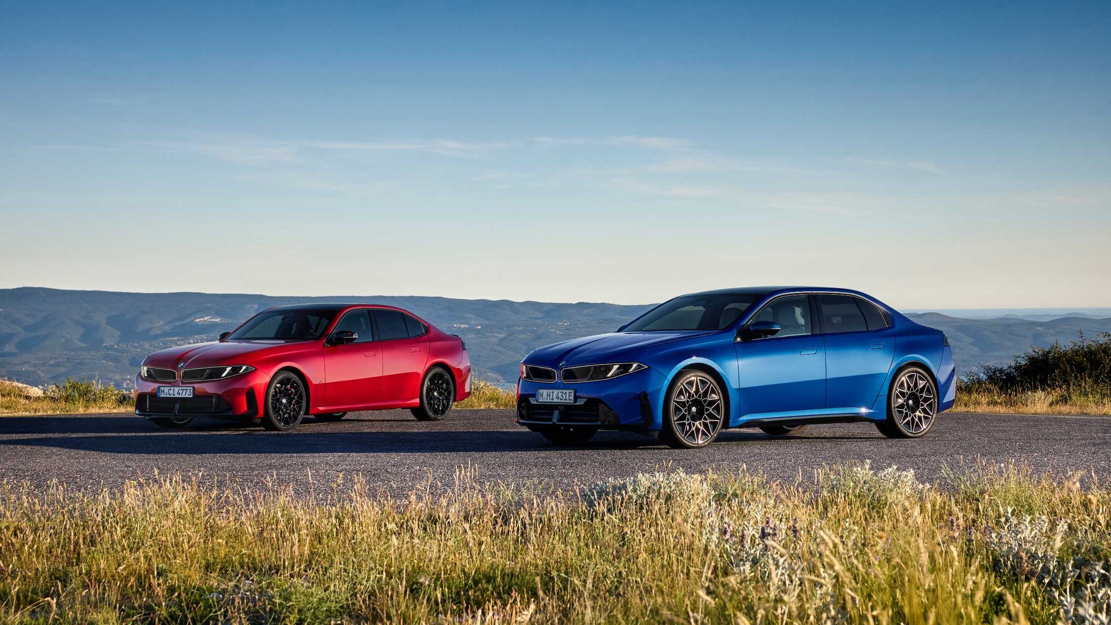 New eighth-generation BMW 3 Series and electric i3 parked side by side
