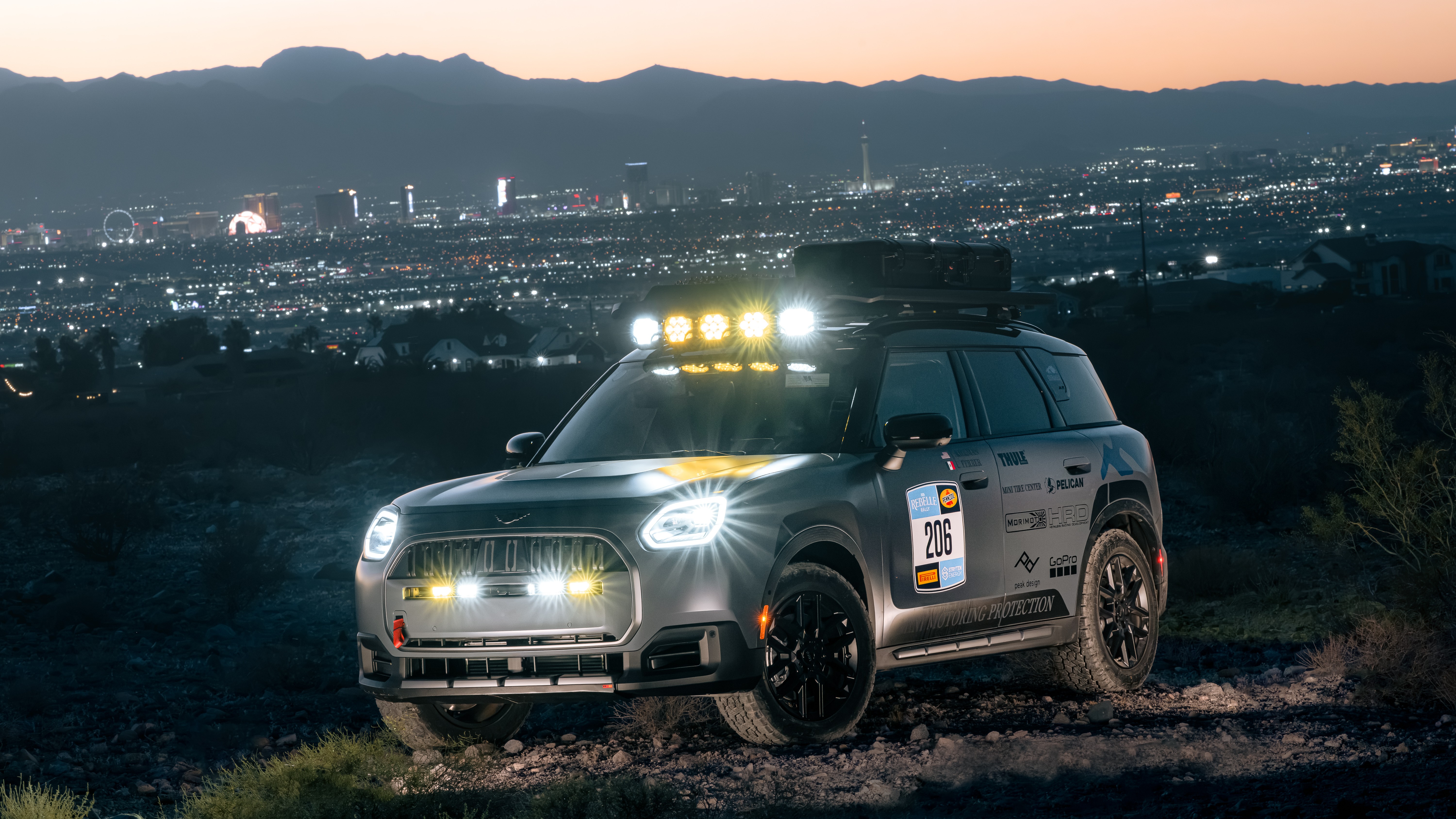 MINI Countryman Untamed Edition rally car No. 206 above Las Vegas at dusk