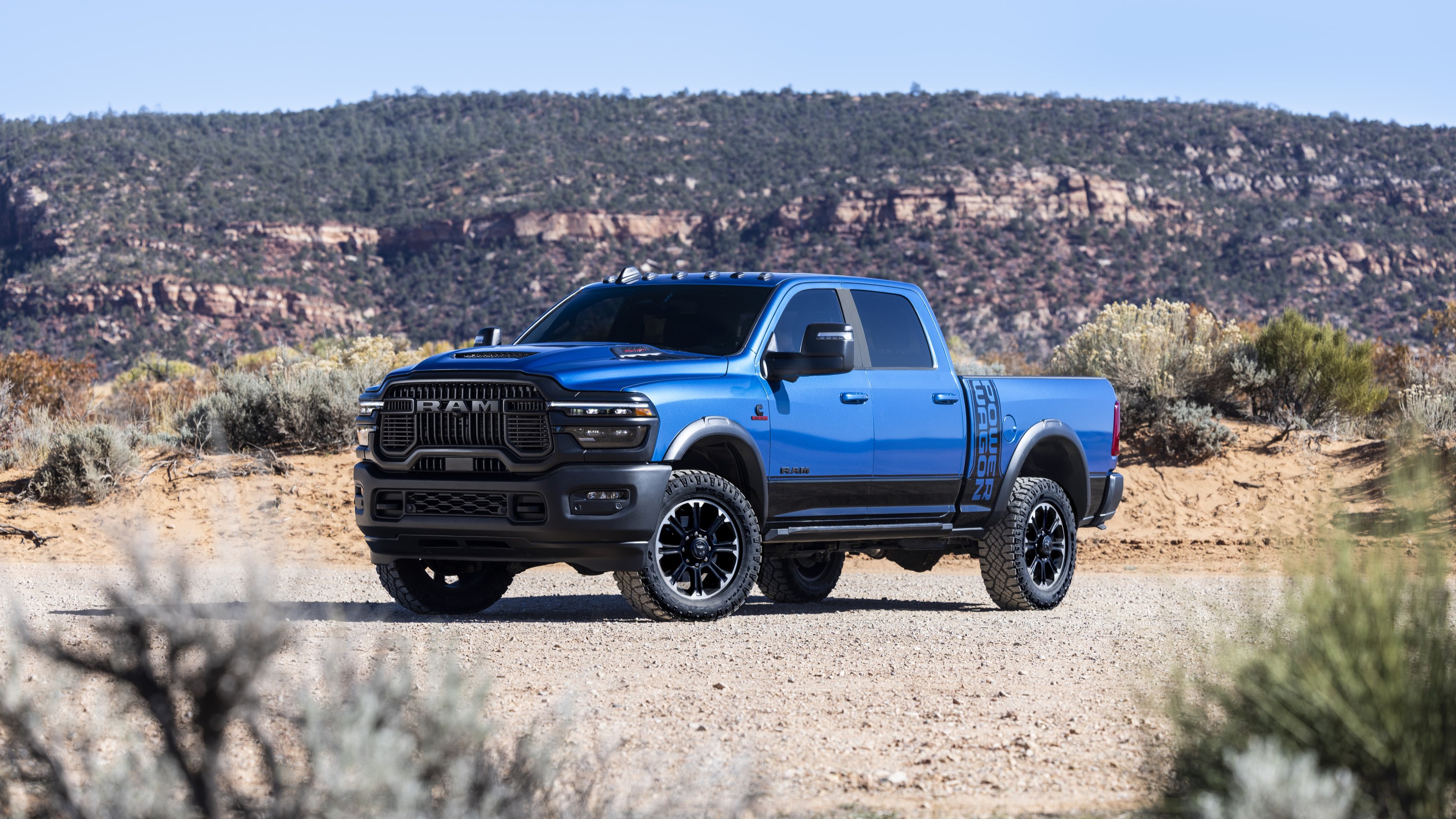 Blue 2027 Ram 2500 Power Wagon parked on a desert trail
