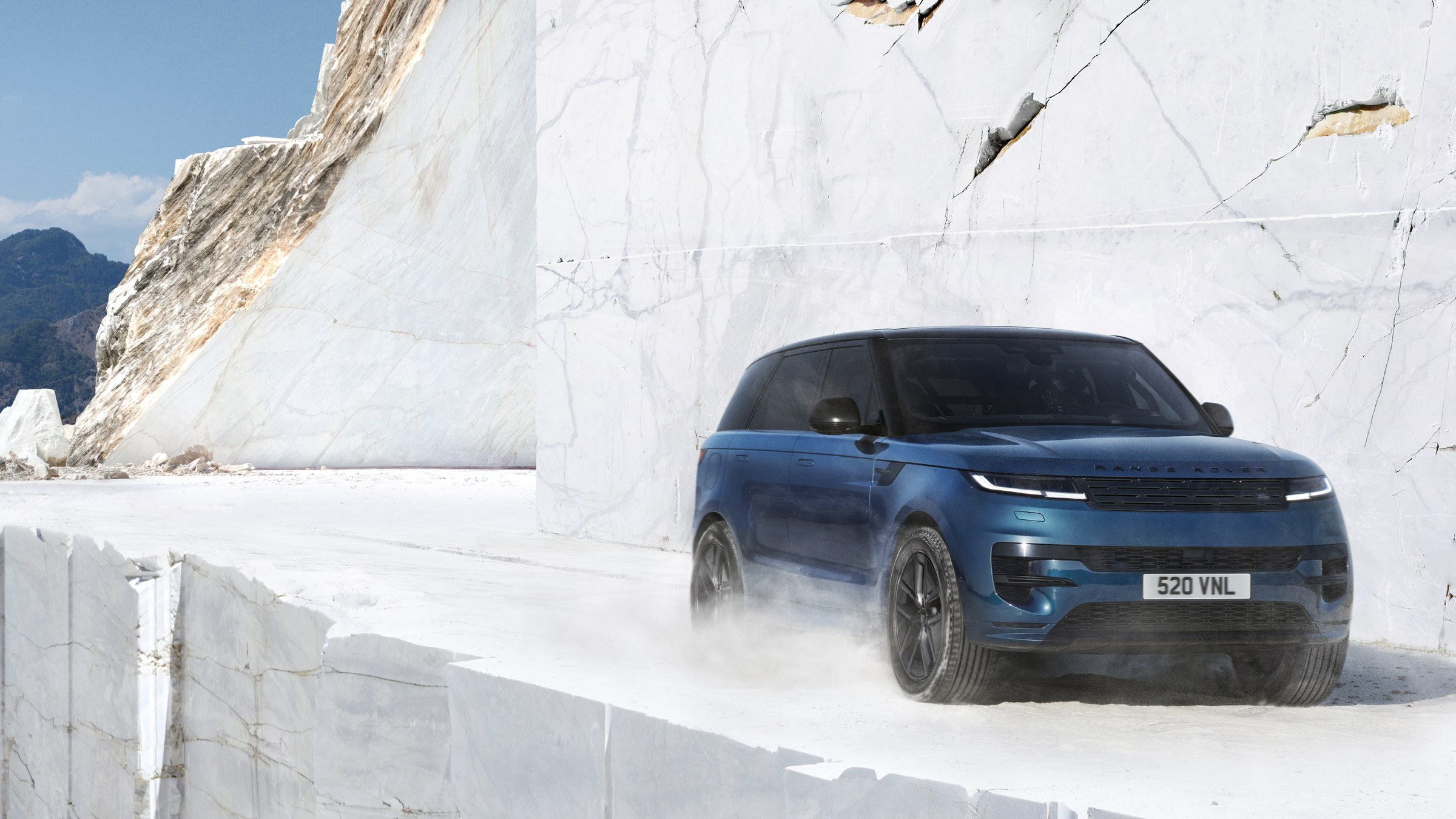Range Rover Sport Electric in Petrolix Blue, front three-quarter view in a marble quarry