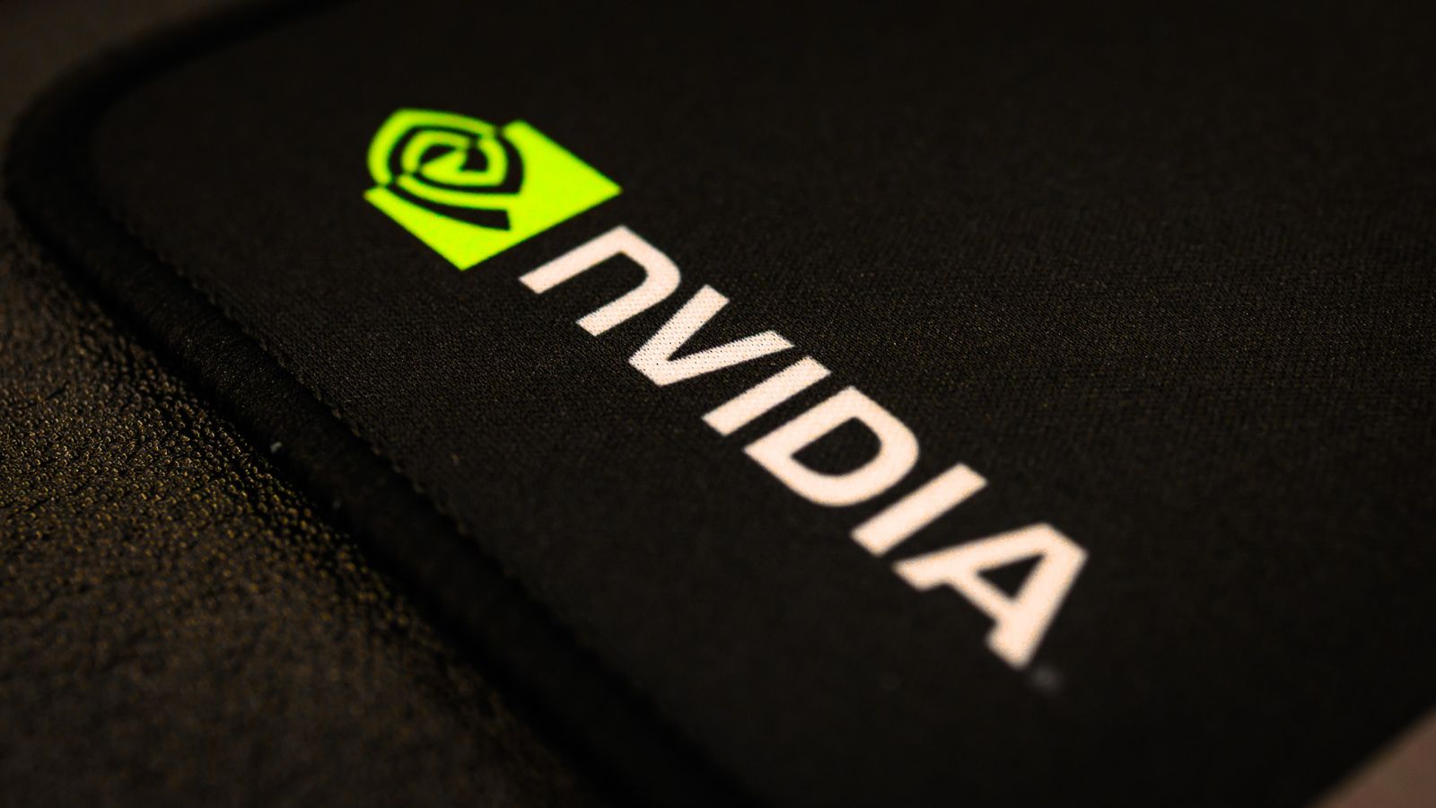 NVIDIA logo printed on a black fabric surface, close-up
