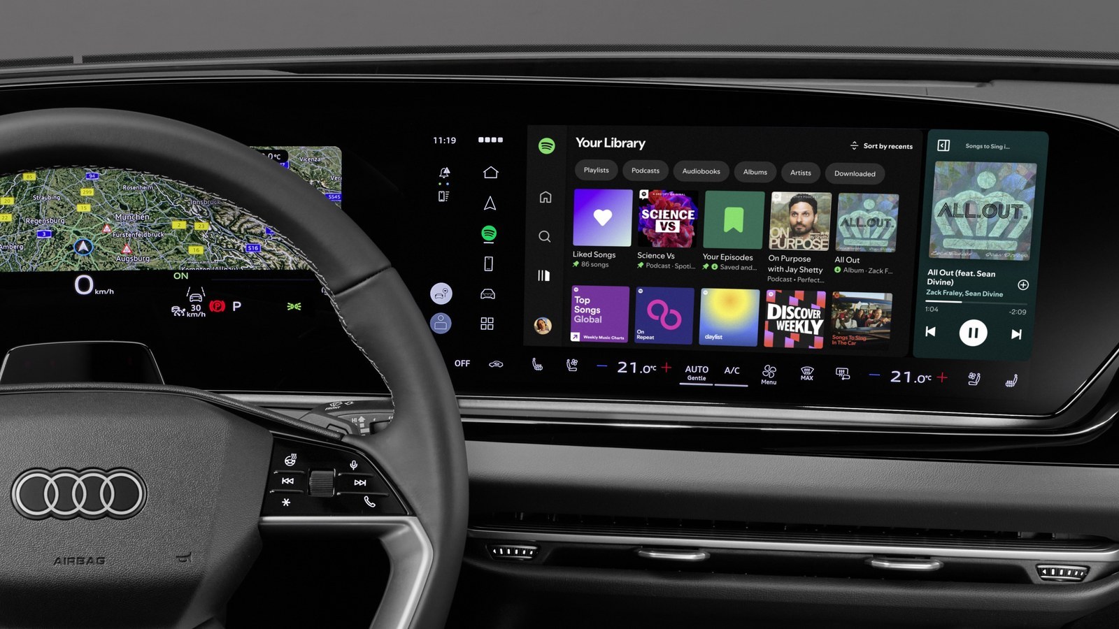 Spotify app on an Audi MMI touchscreen next to the digital cockpit